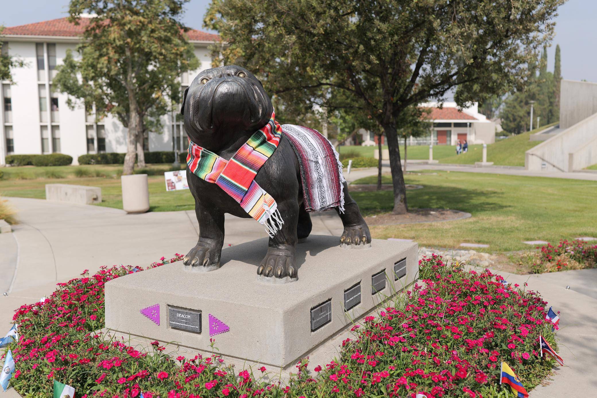 a statue of a dog with a scarf on it
