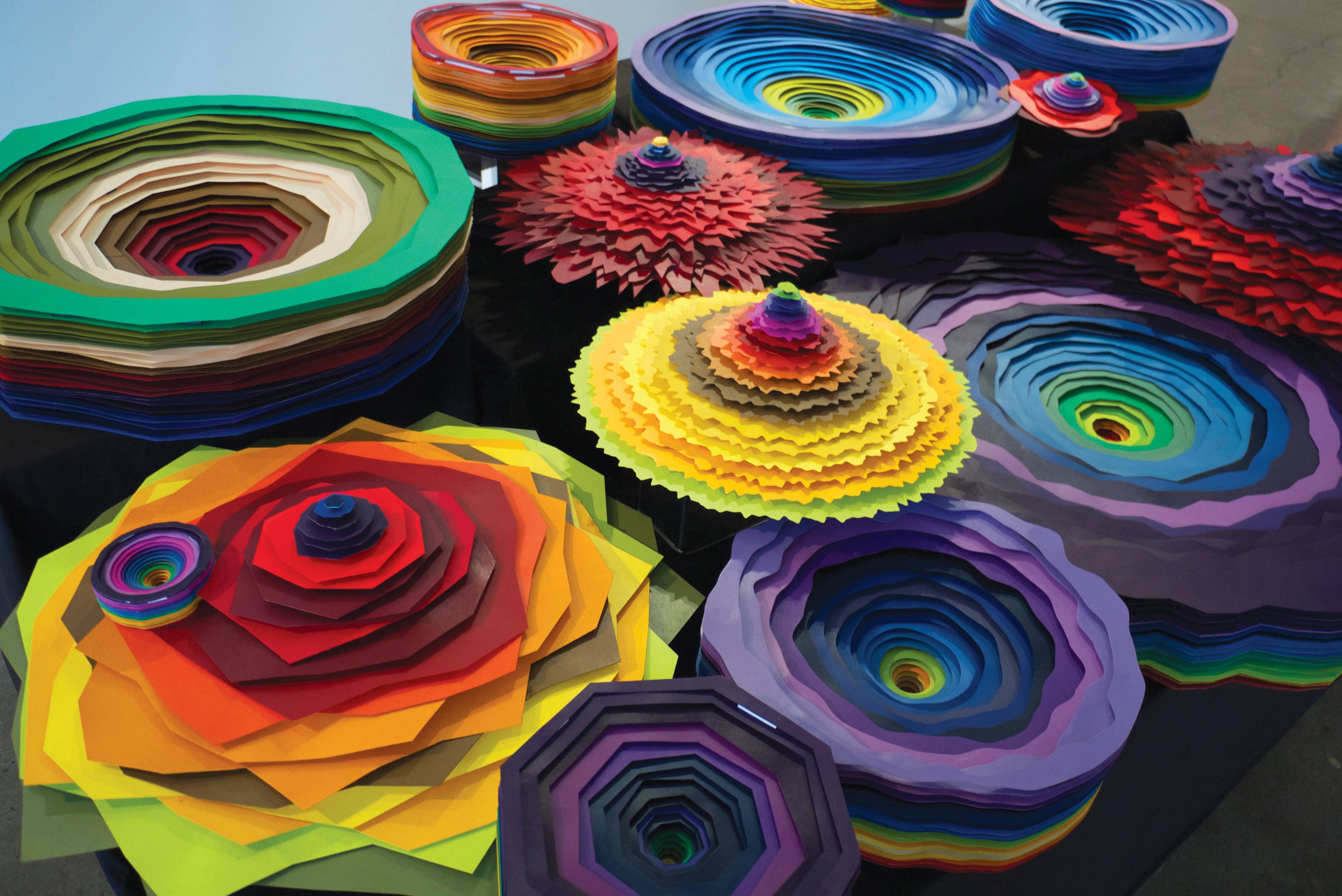 a group of colorful paper flowers