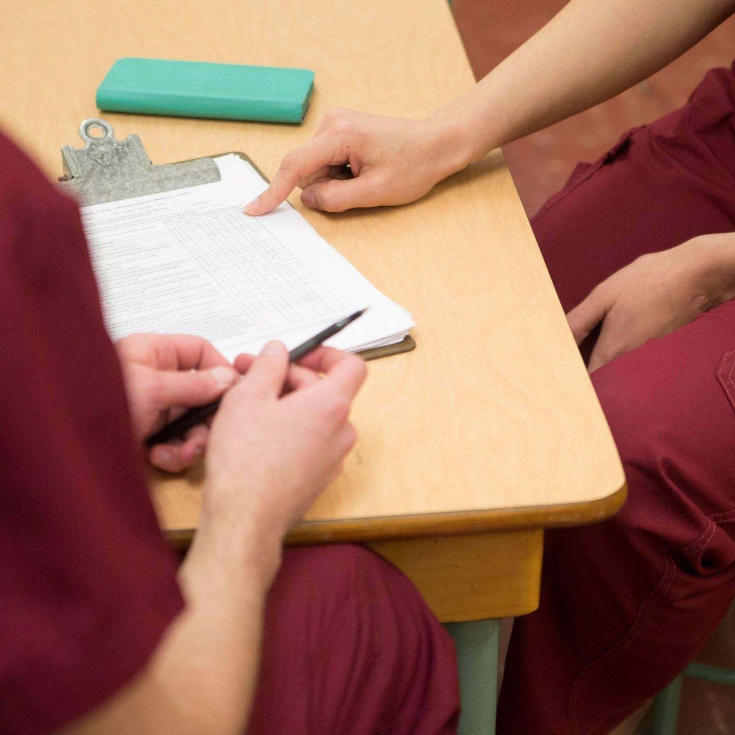 a pair of people sitting at a table