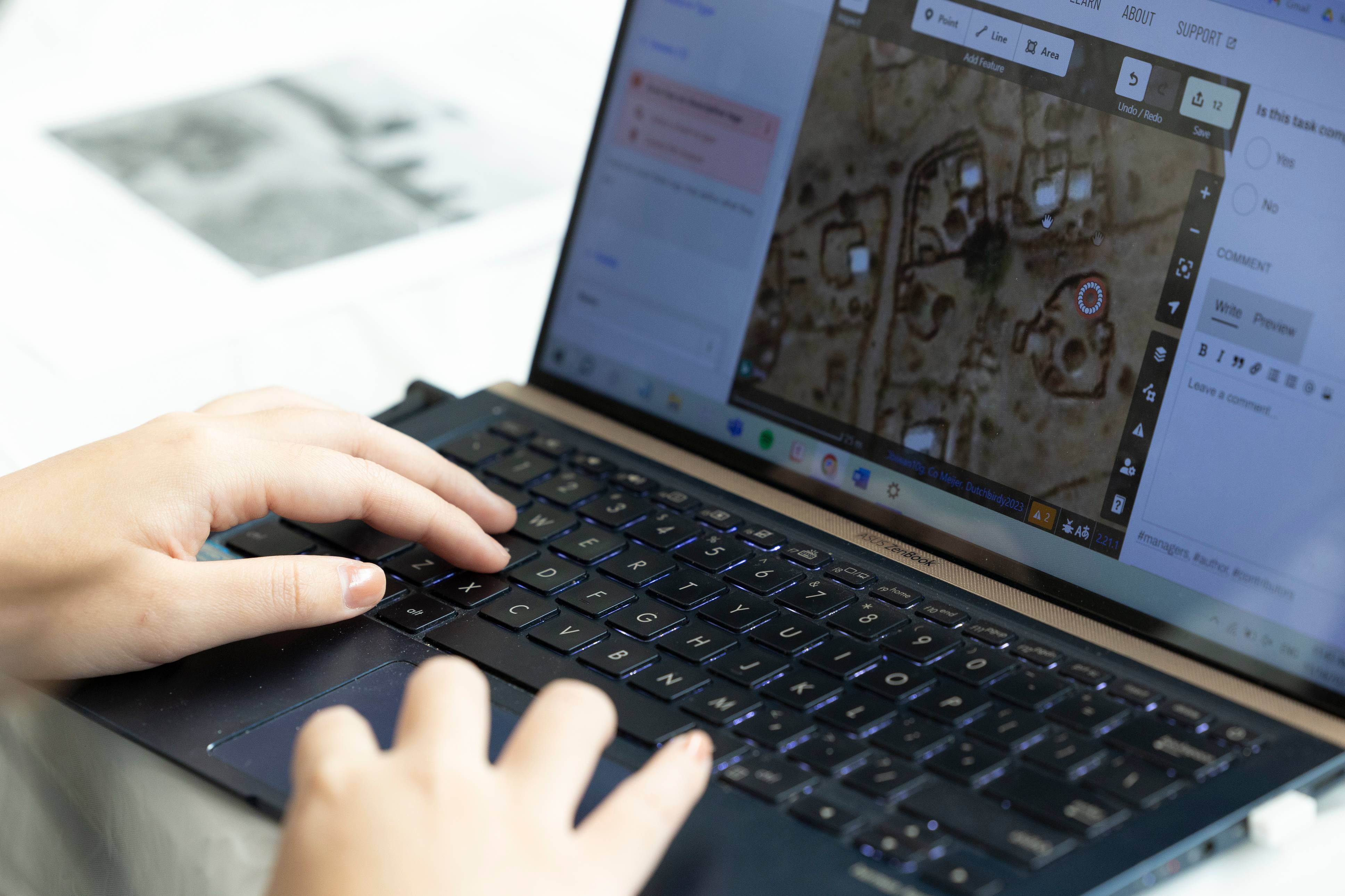 a person typing on a laptop