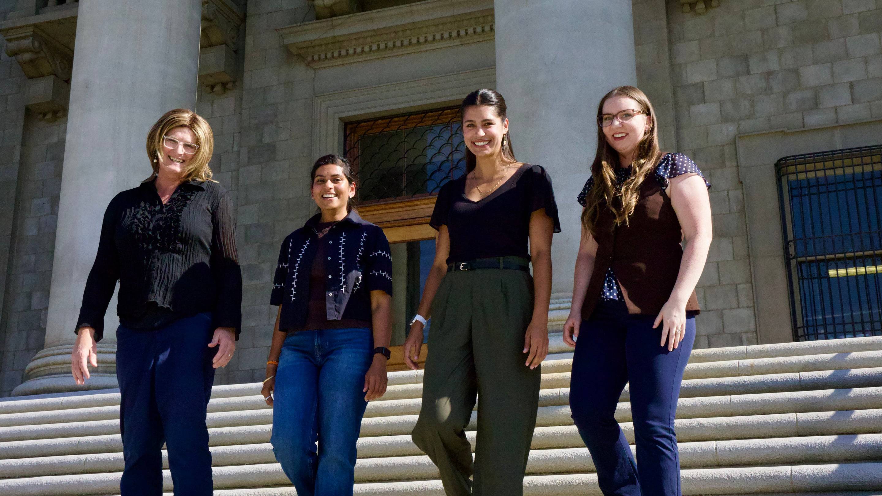 a group of women standing on steps