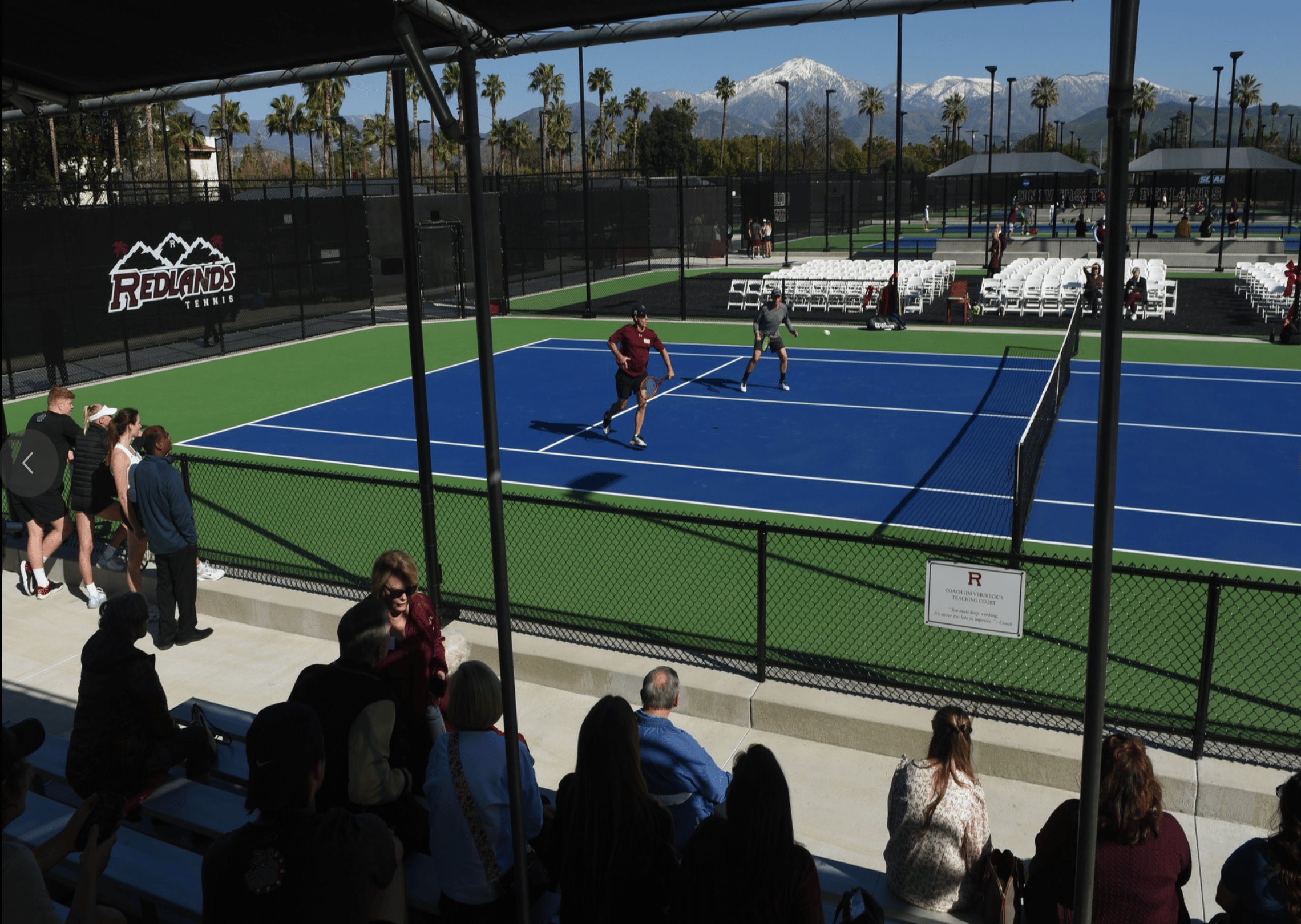 people watching a tennis match