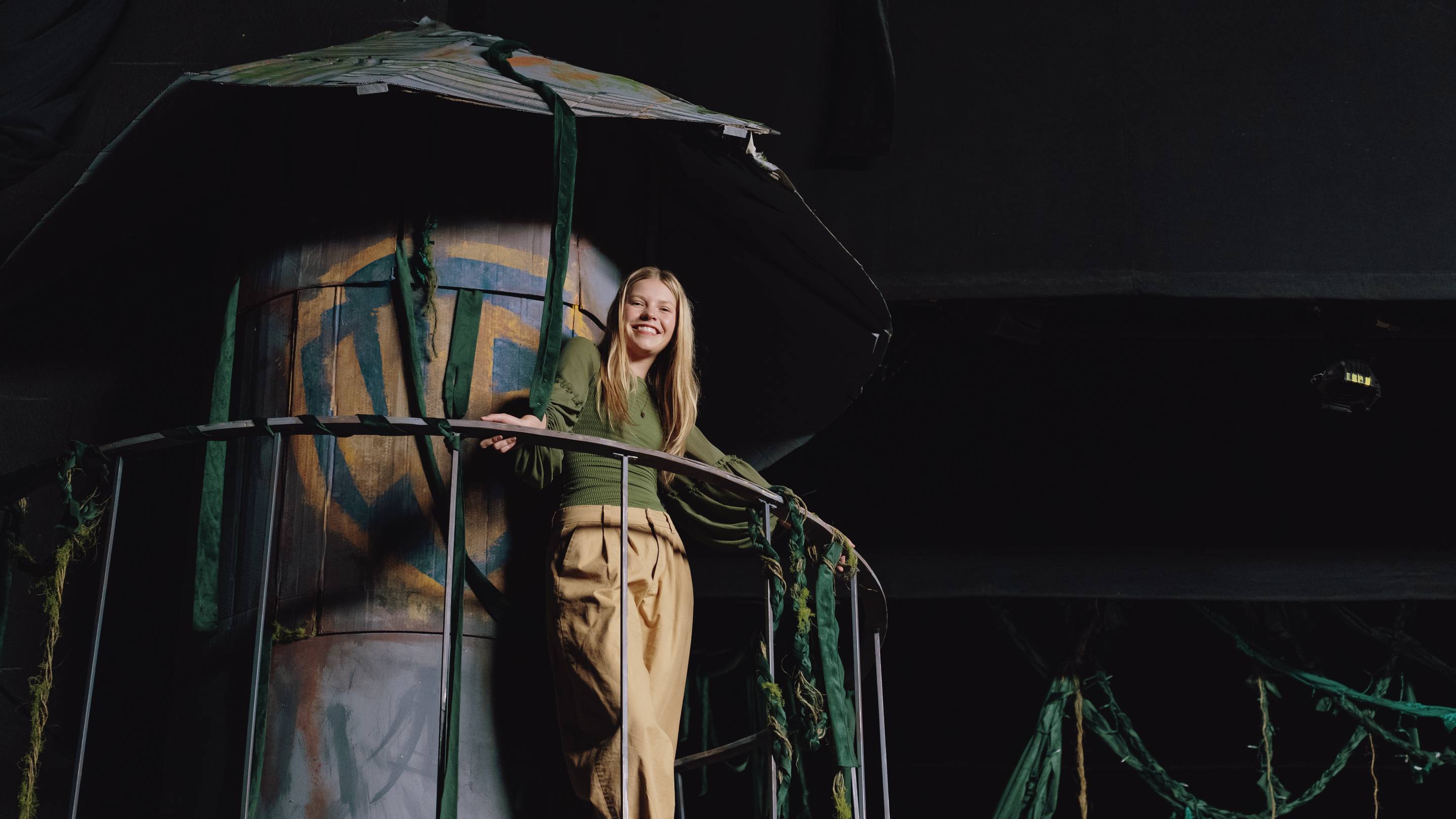 a person leaning on a railing