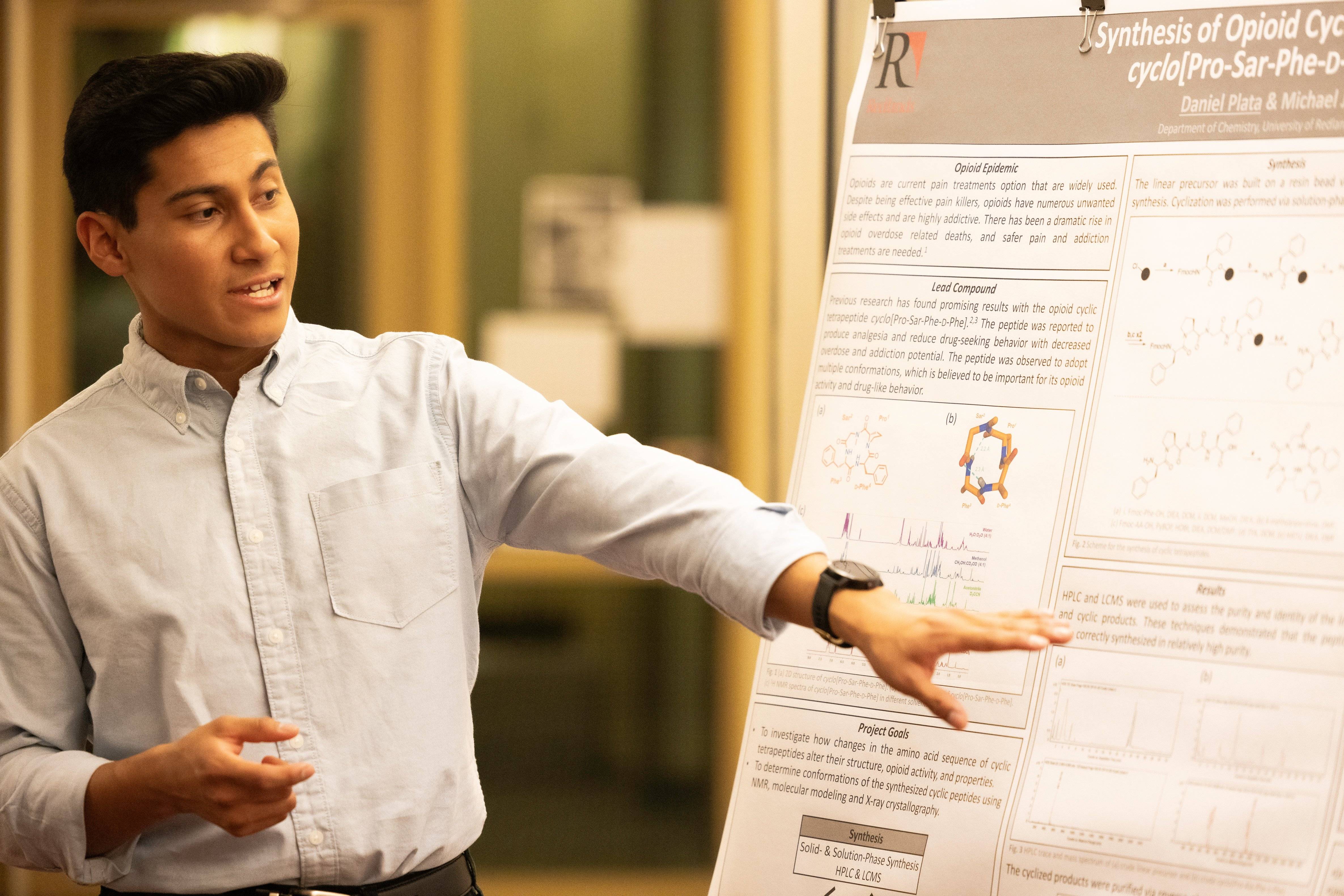 a person pointing at a white board