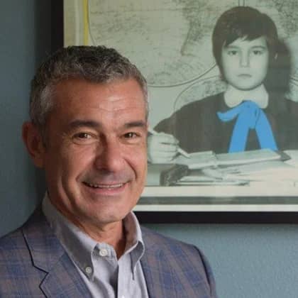 a person standing next to a picture