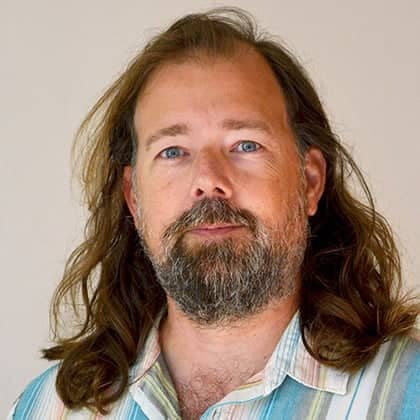 a person with long hair and beard