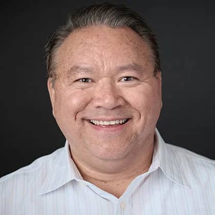 a person smiling at the camera