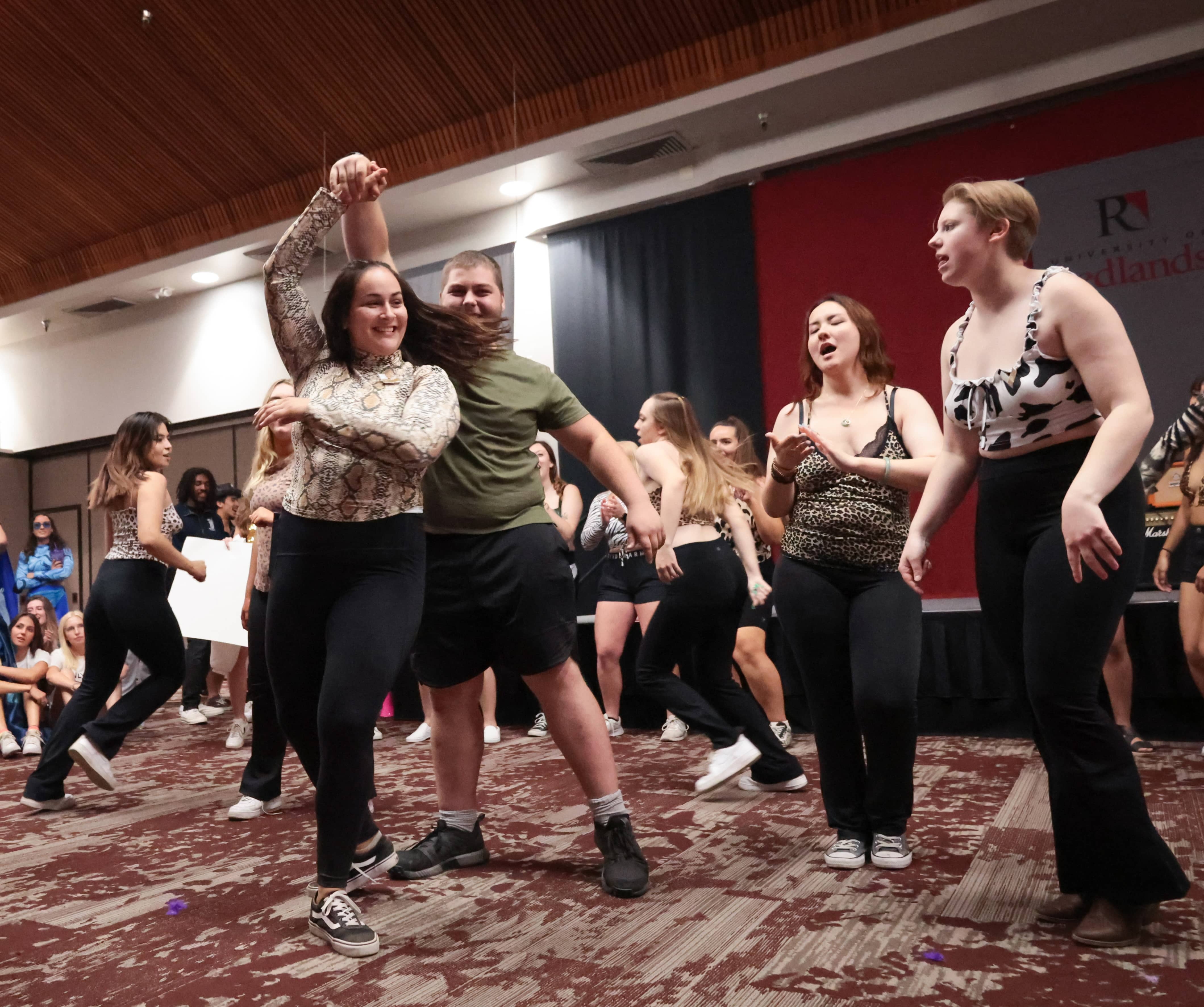 a group of people dancing in a room