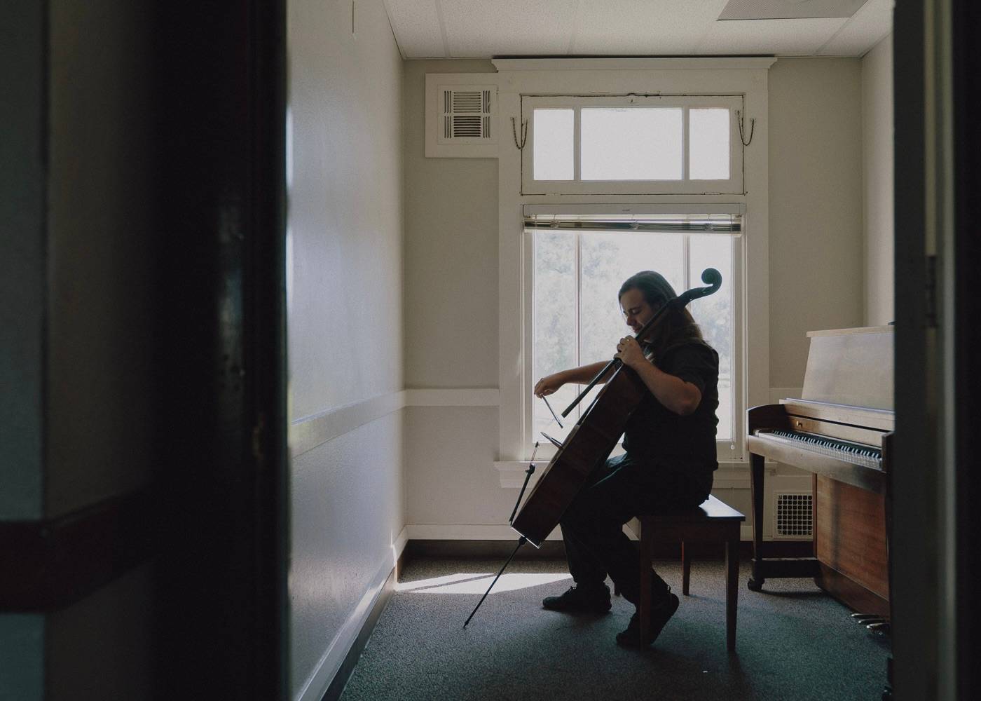 a person playing a cello