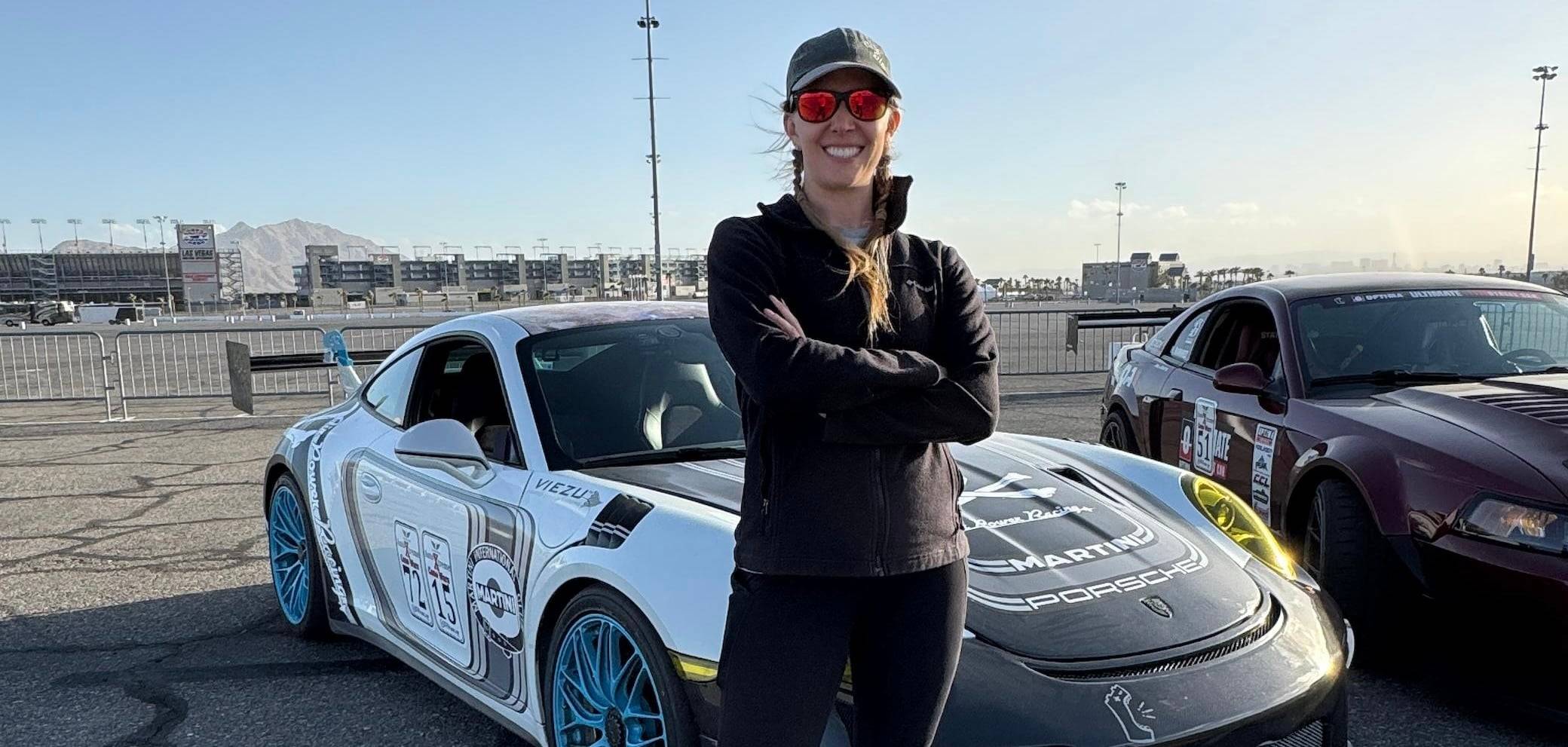 a person standing in front of a car