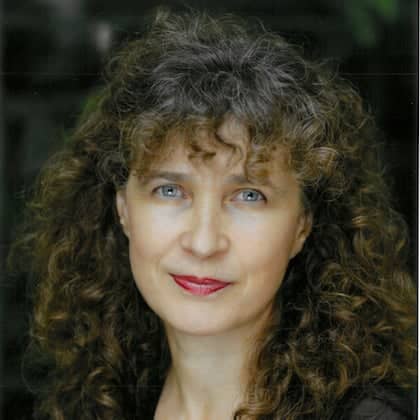a person with curly hair and red lipstick