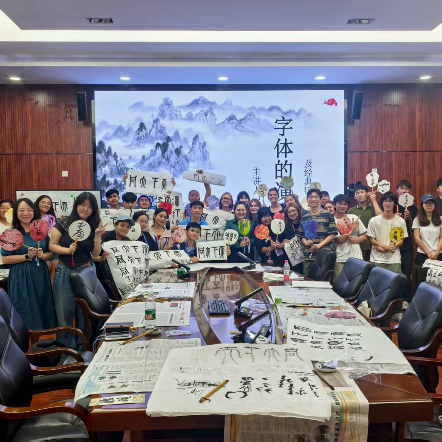 a group of people holding signs in a room