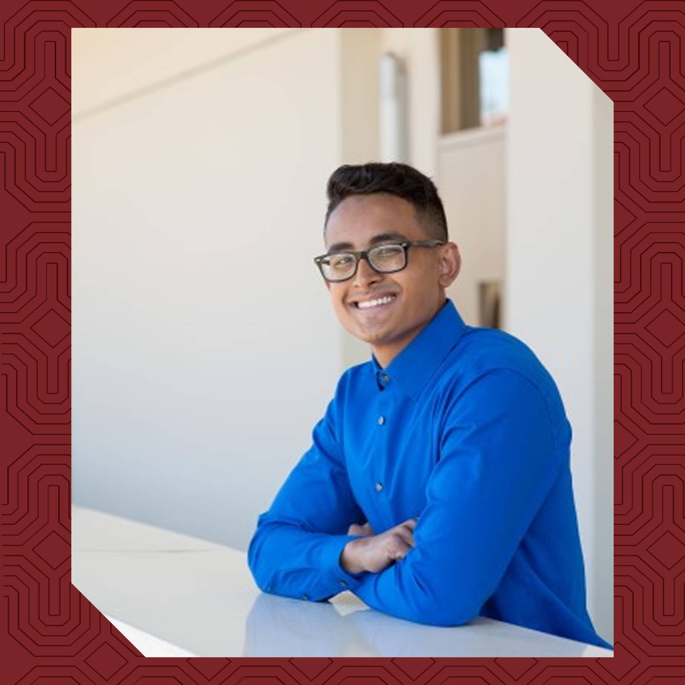 a person wearing glasses and a blue shirt