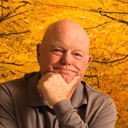 a person with his hand on his chin