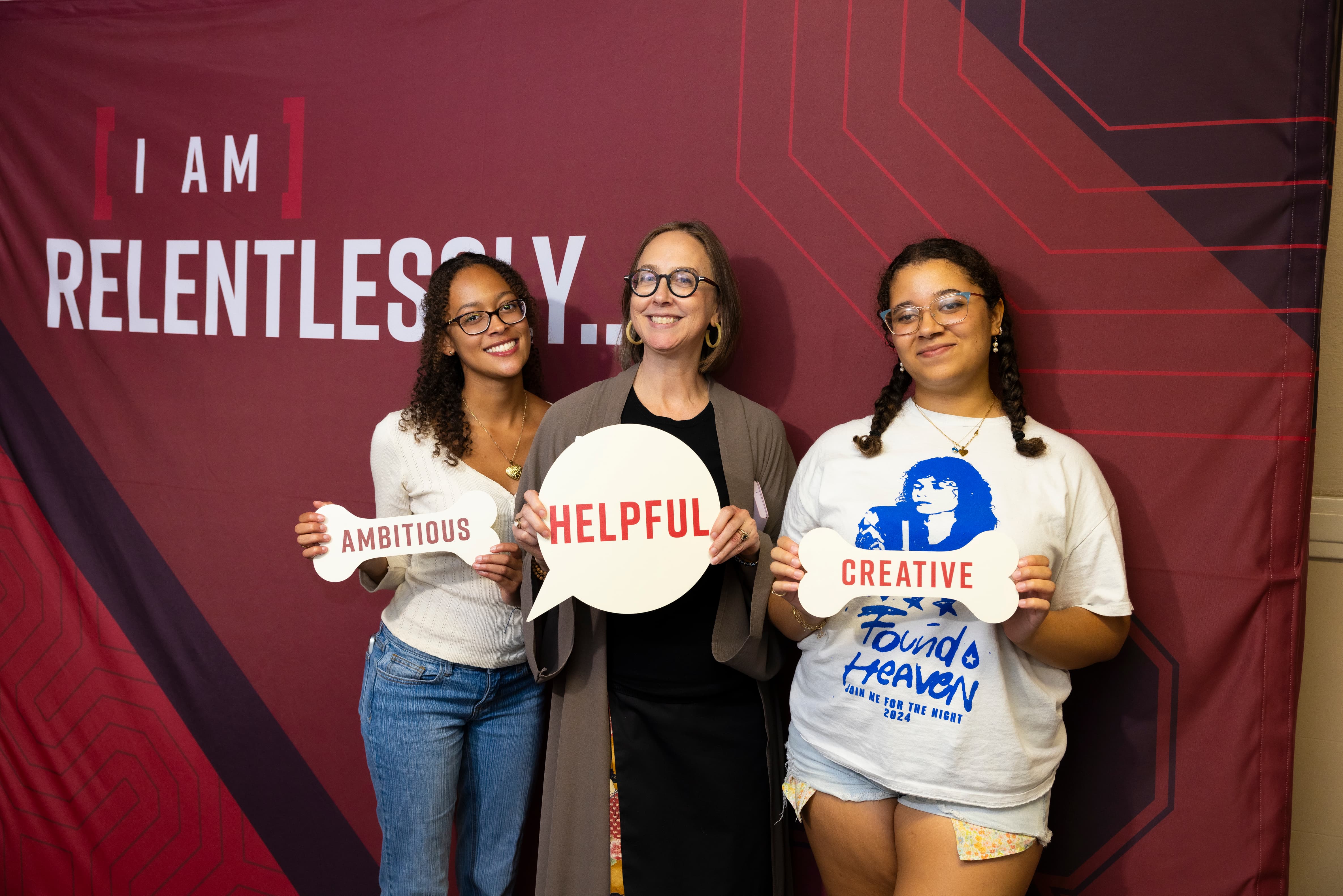 a group of women holding signs