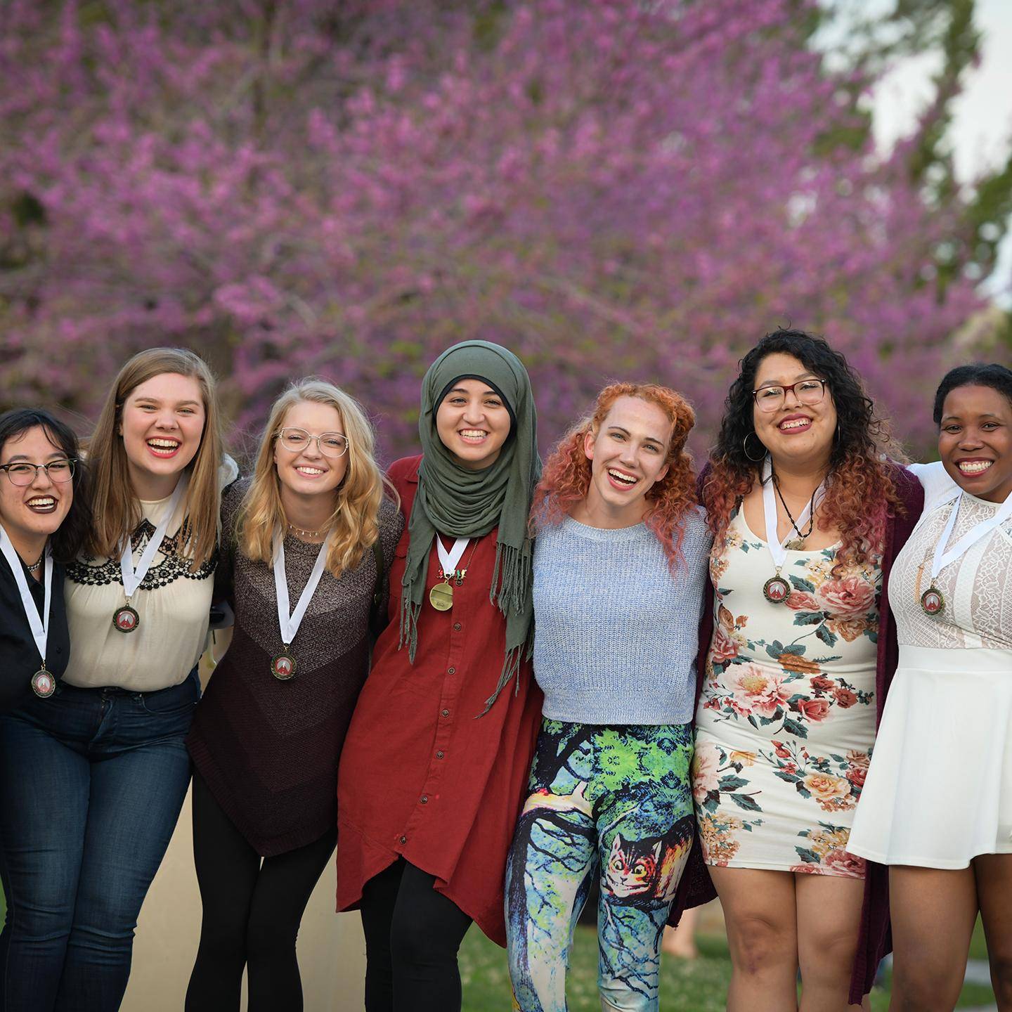 a group of women posing for a photo