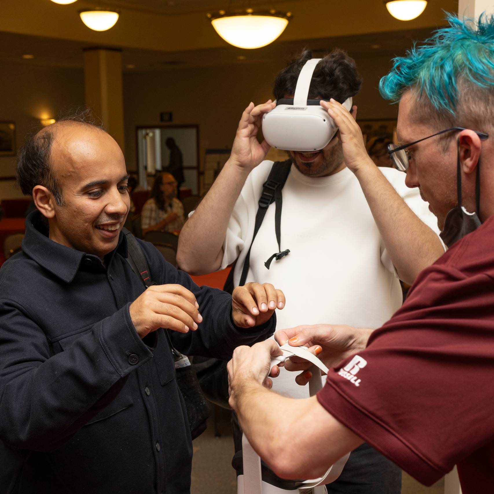 a group of men wearing virtual reality goggles