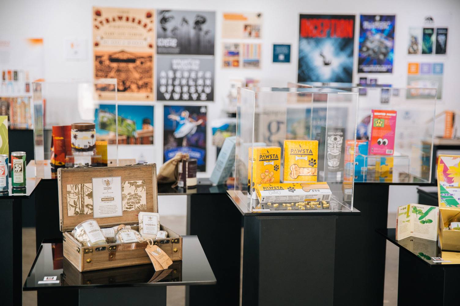 a display case with a box of books and a box of food