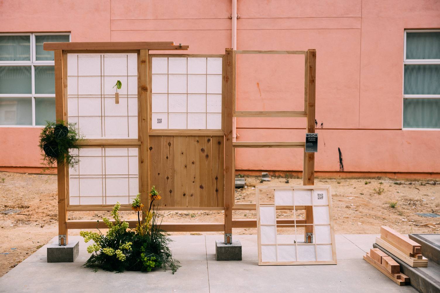 a wood and white screen with plants