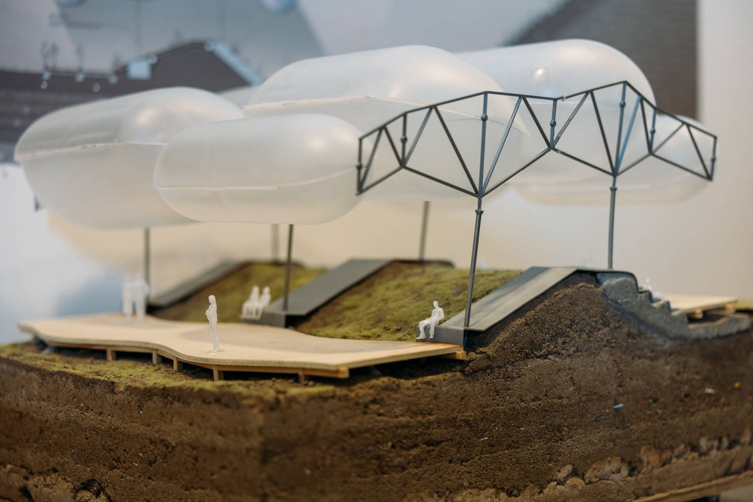 a model of a park with a group of people sitting on a path