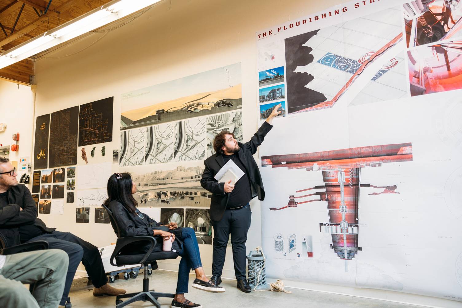 a group of people looking at a poster