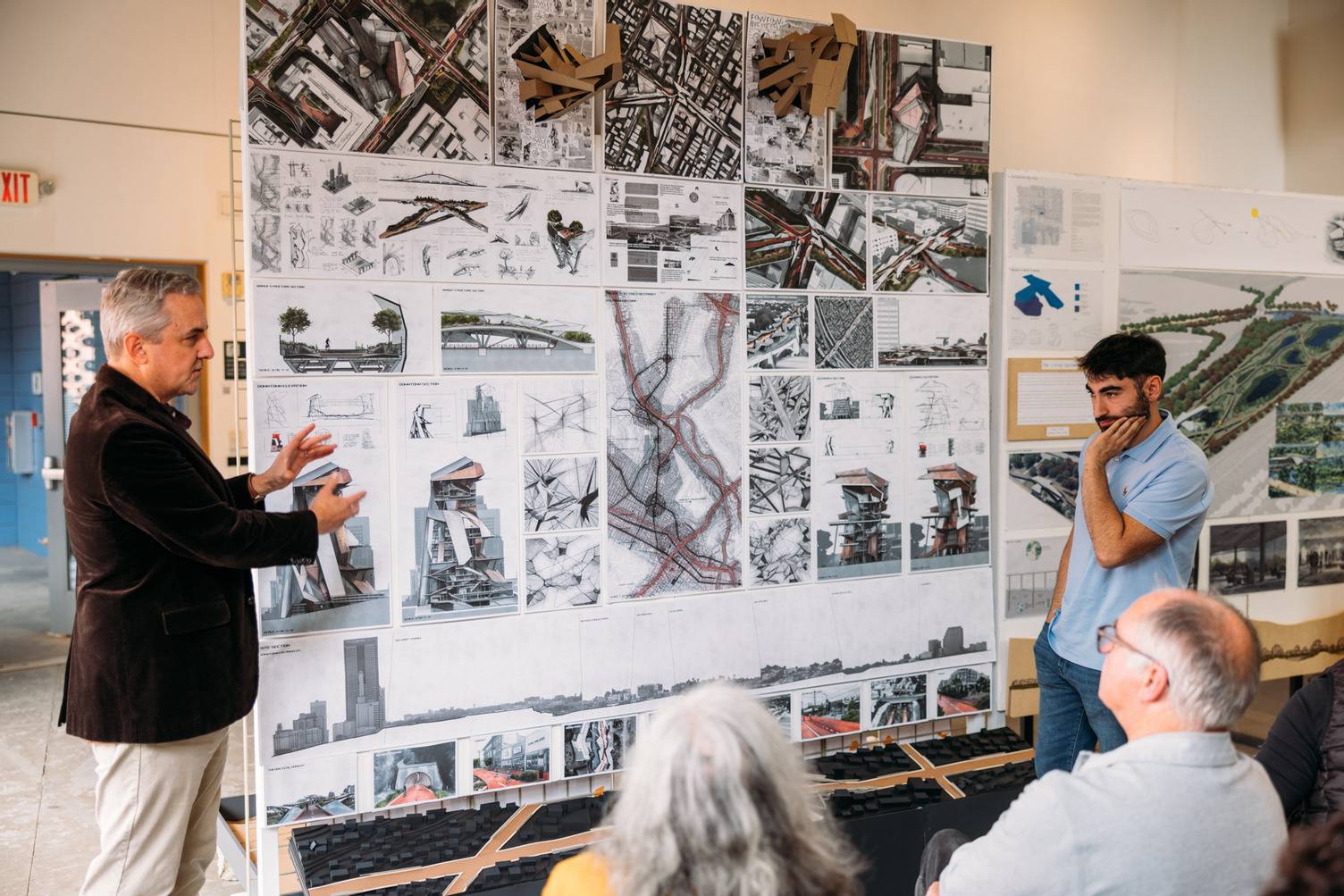 a group of people looking at a poster
