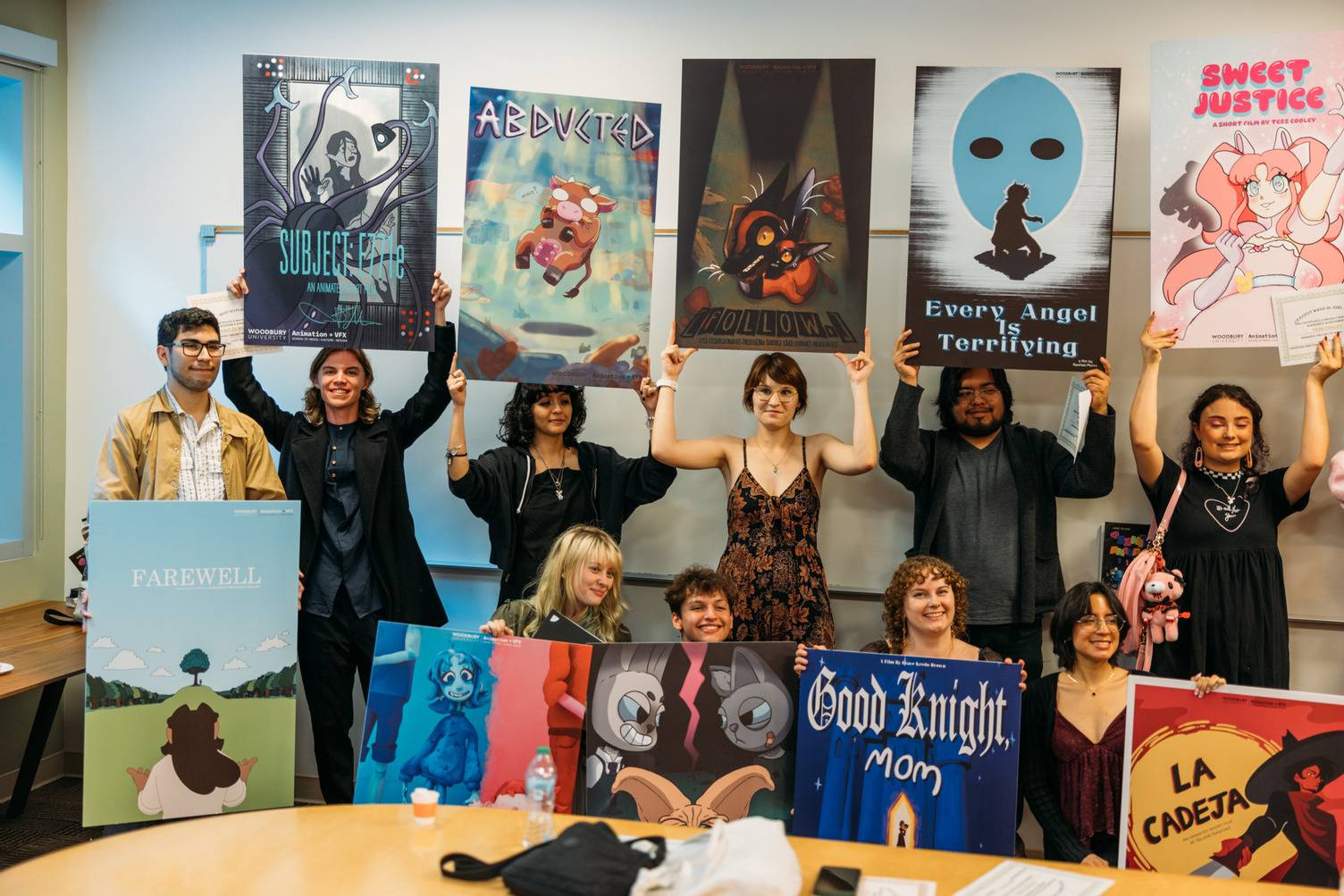 a group of people holding up posters
