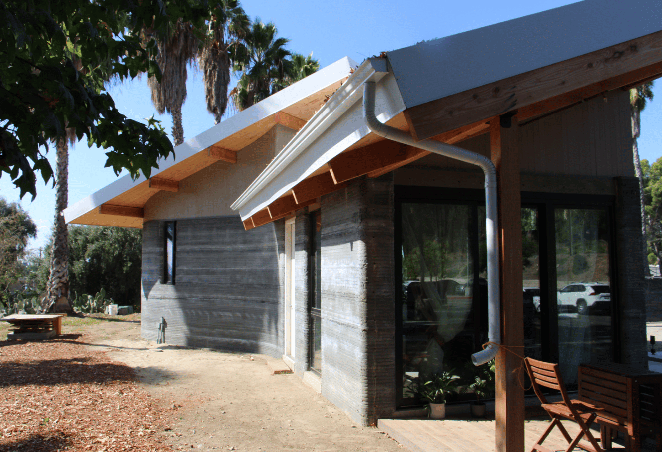 a building with a roof and a porch