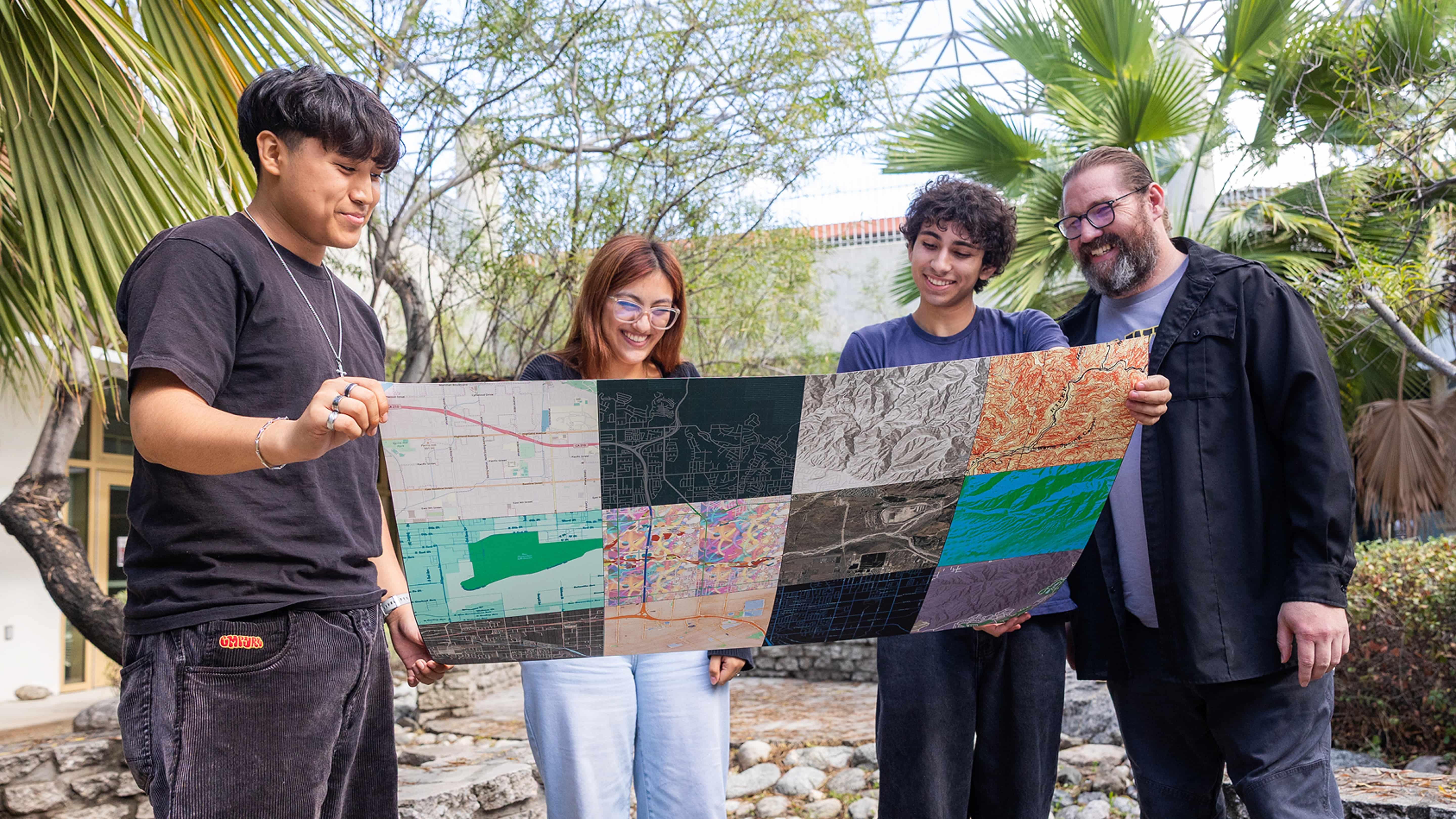 a group of people holding a map