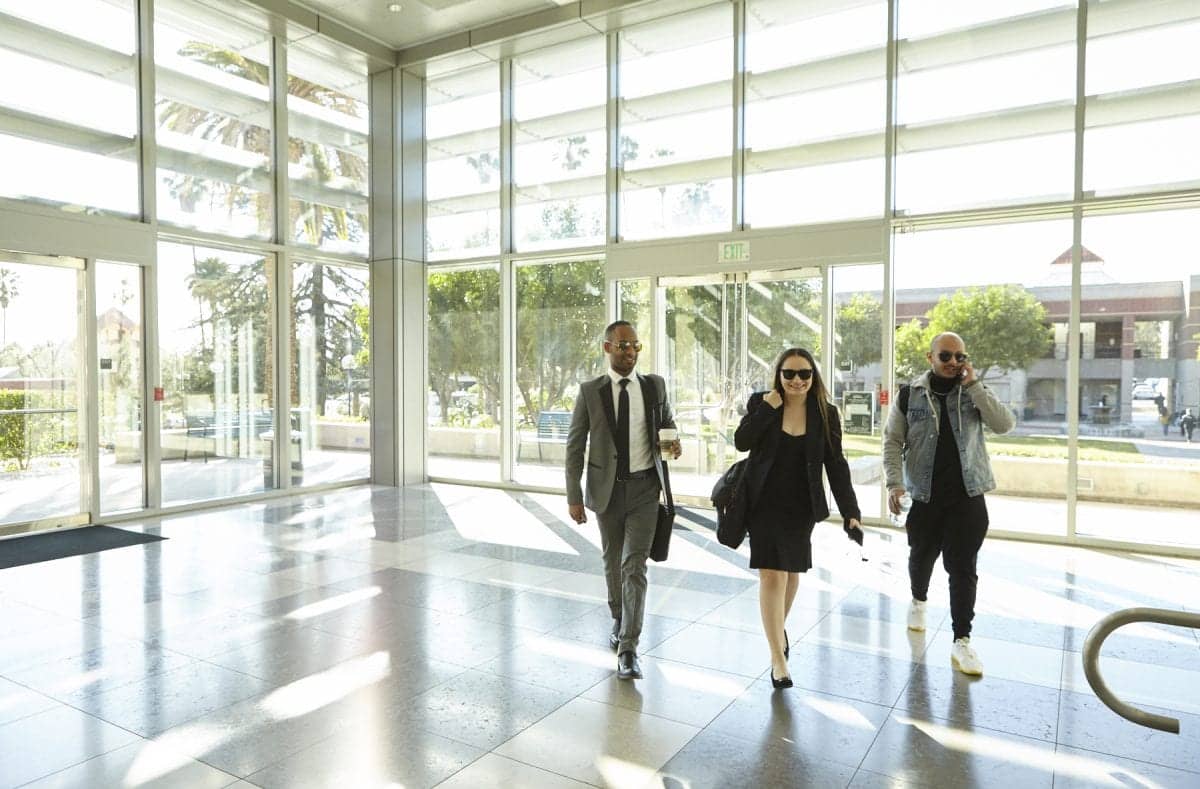 a group of people walking in a building