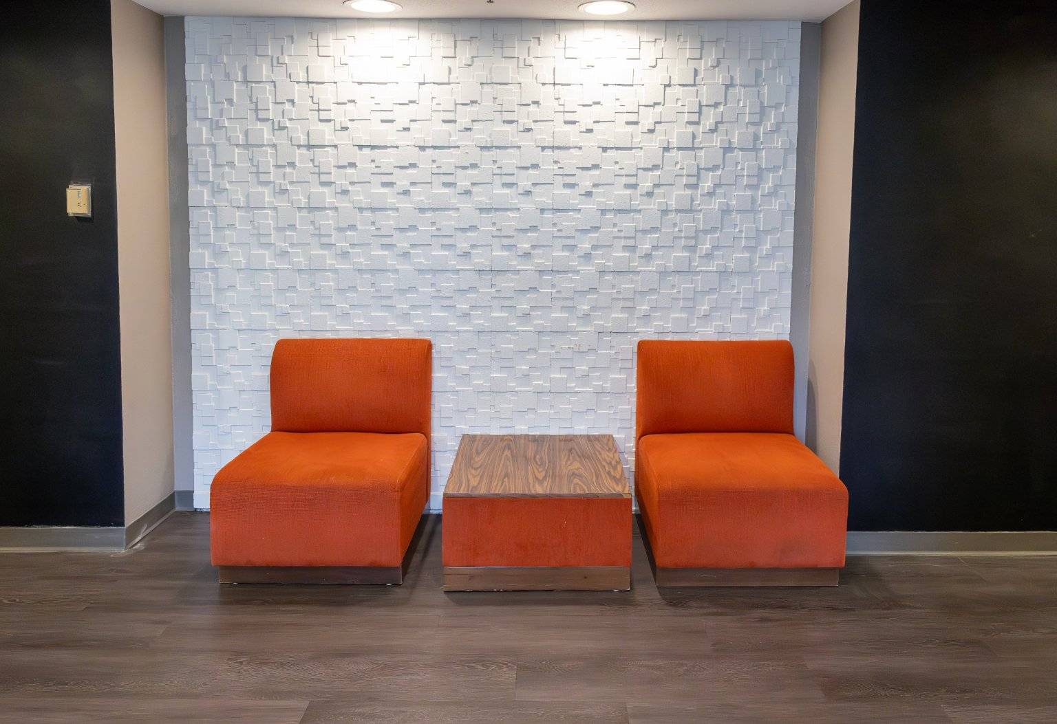 two chairs and a table in a room