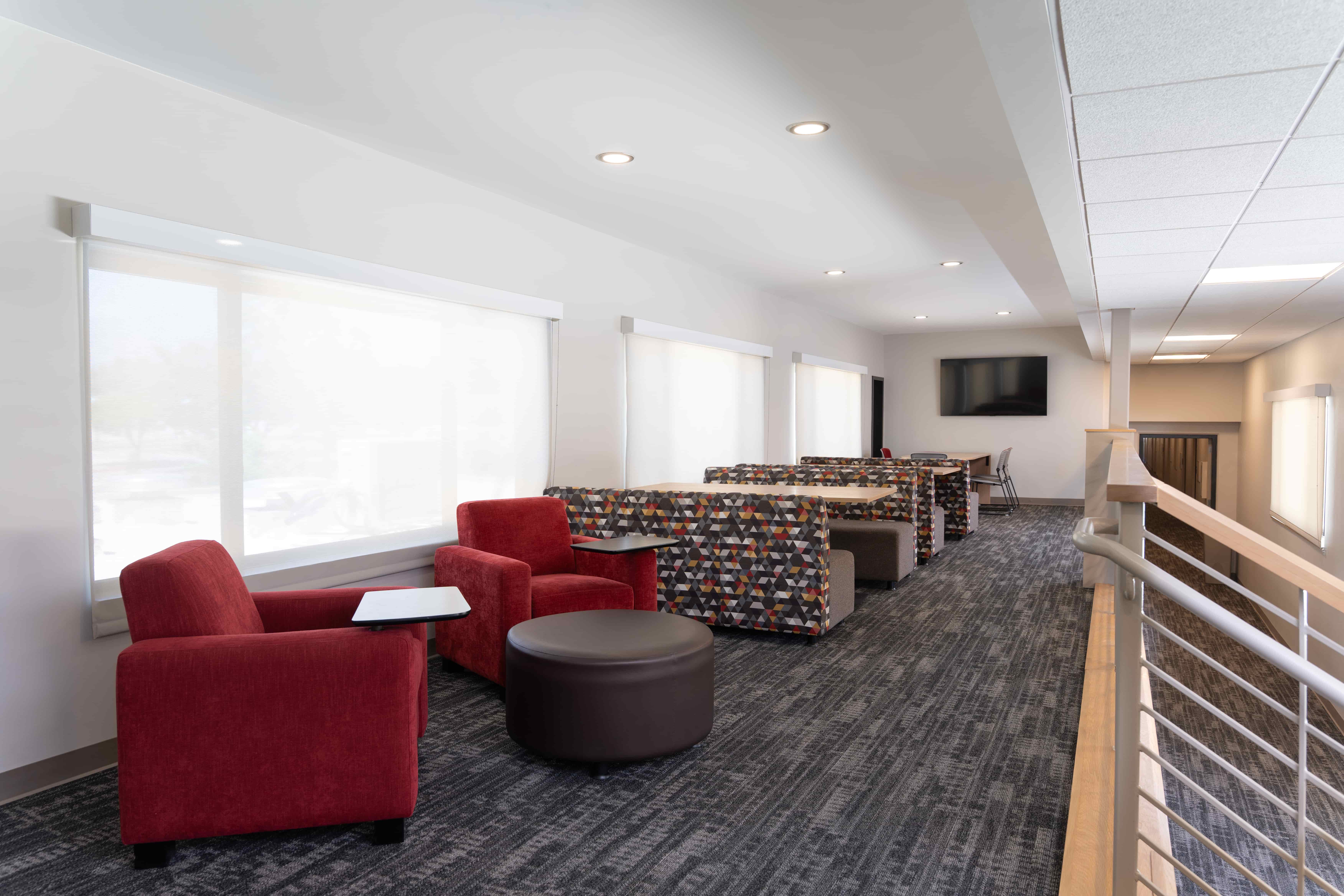 a room with chairs and tables