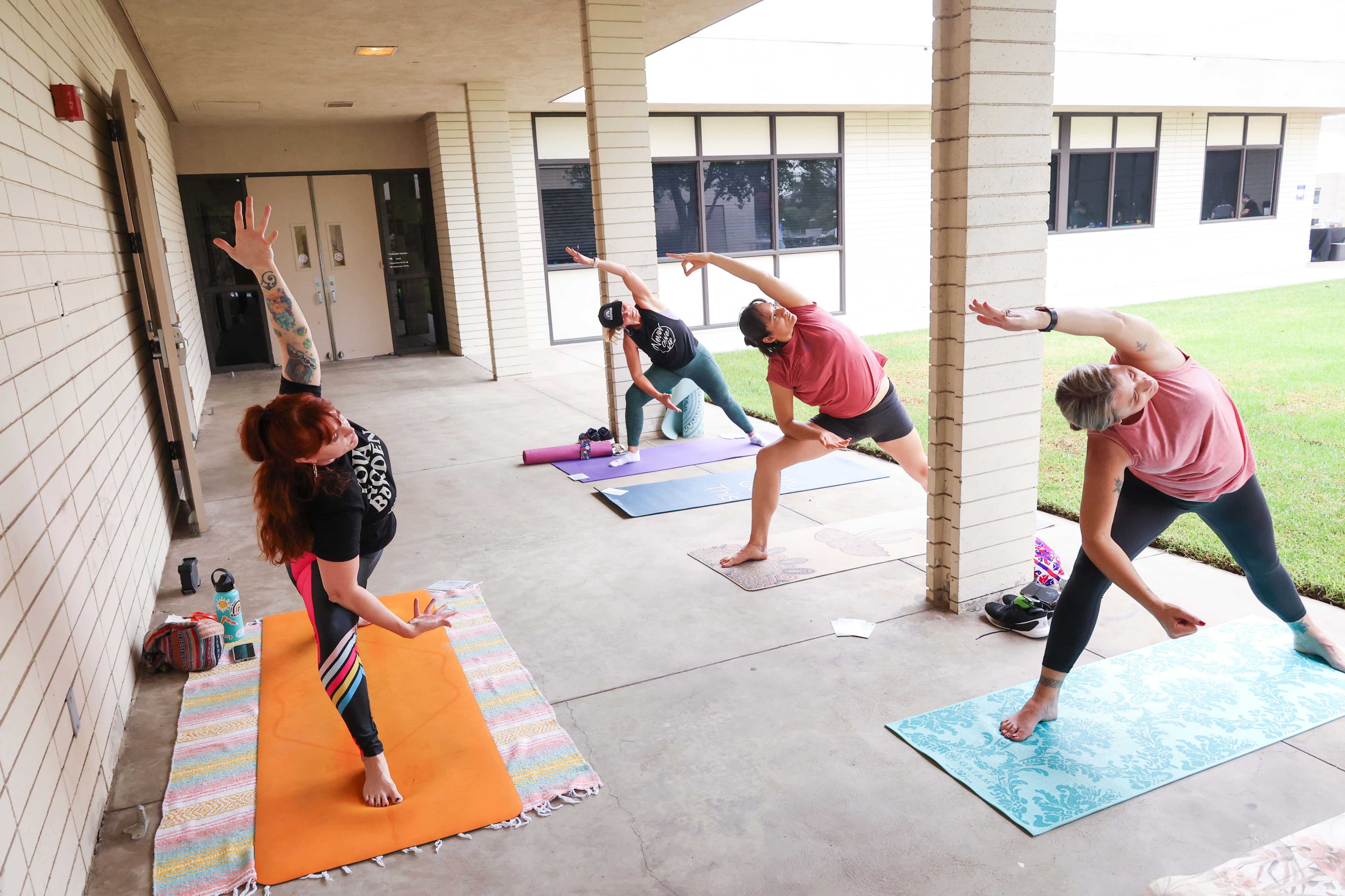 a group of people doing yoga