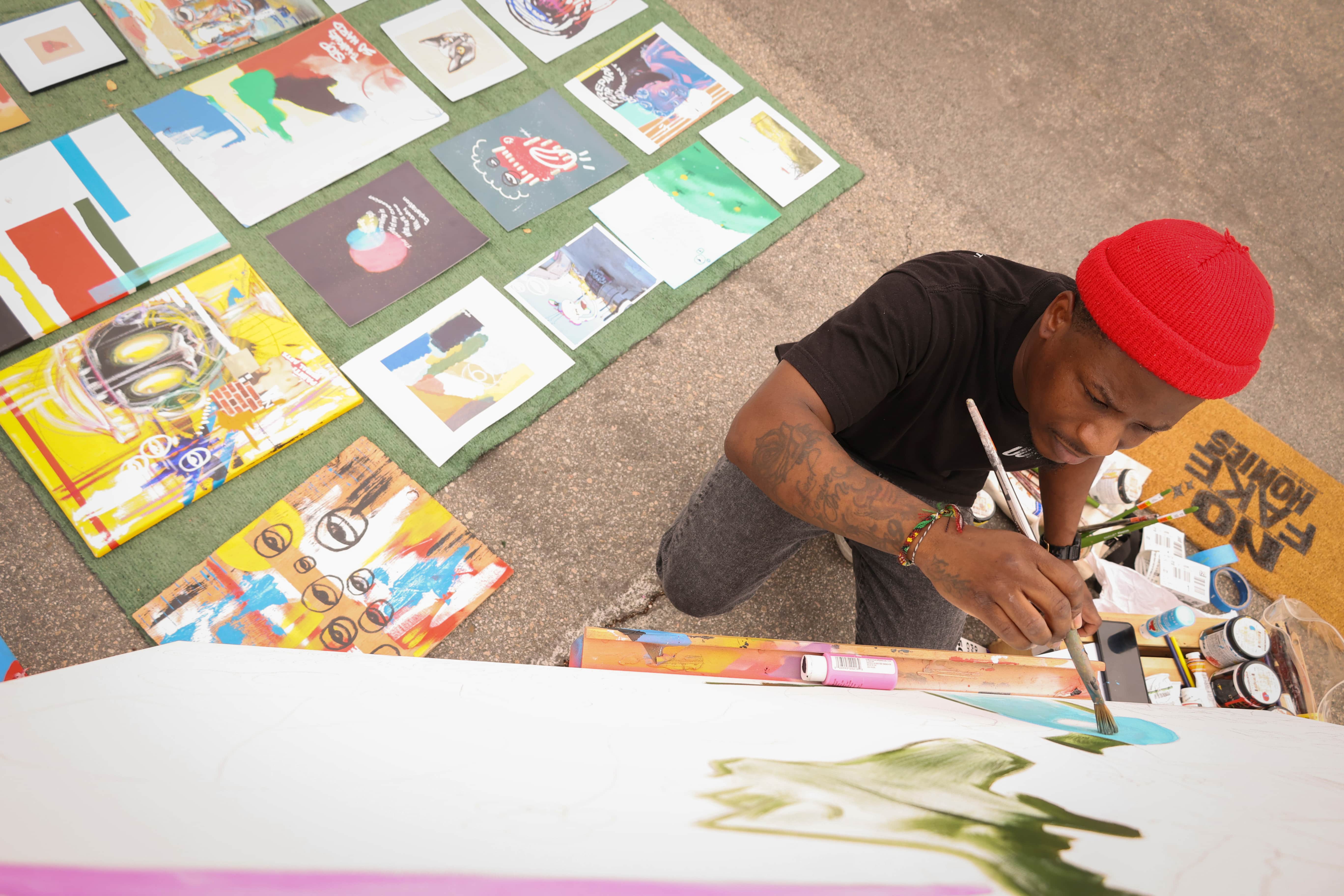 a person painting on a canvas