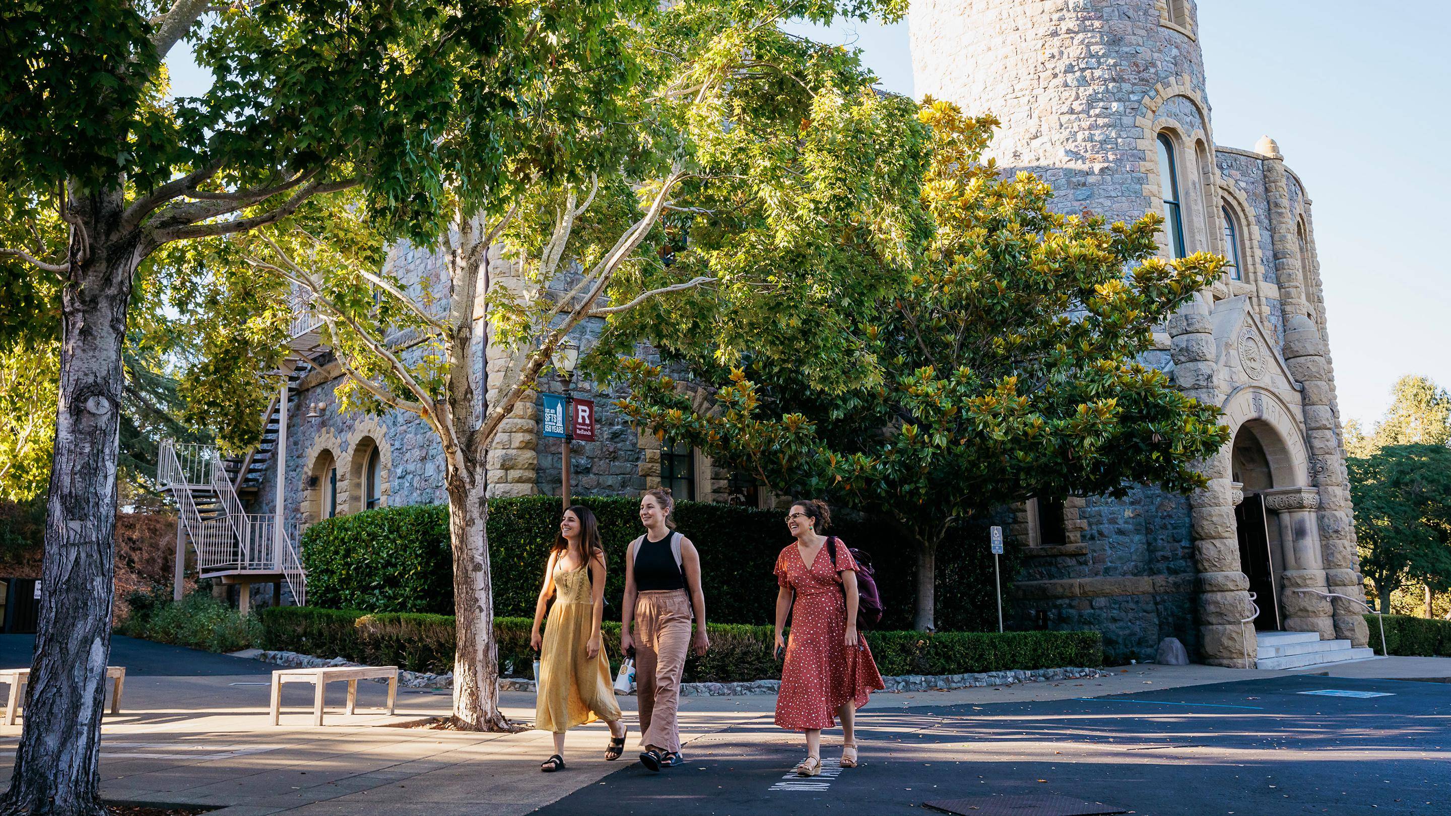 a group of women walking on a street