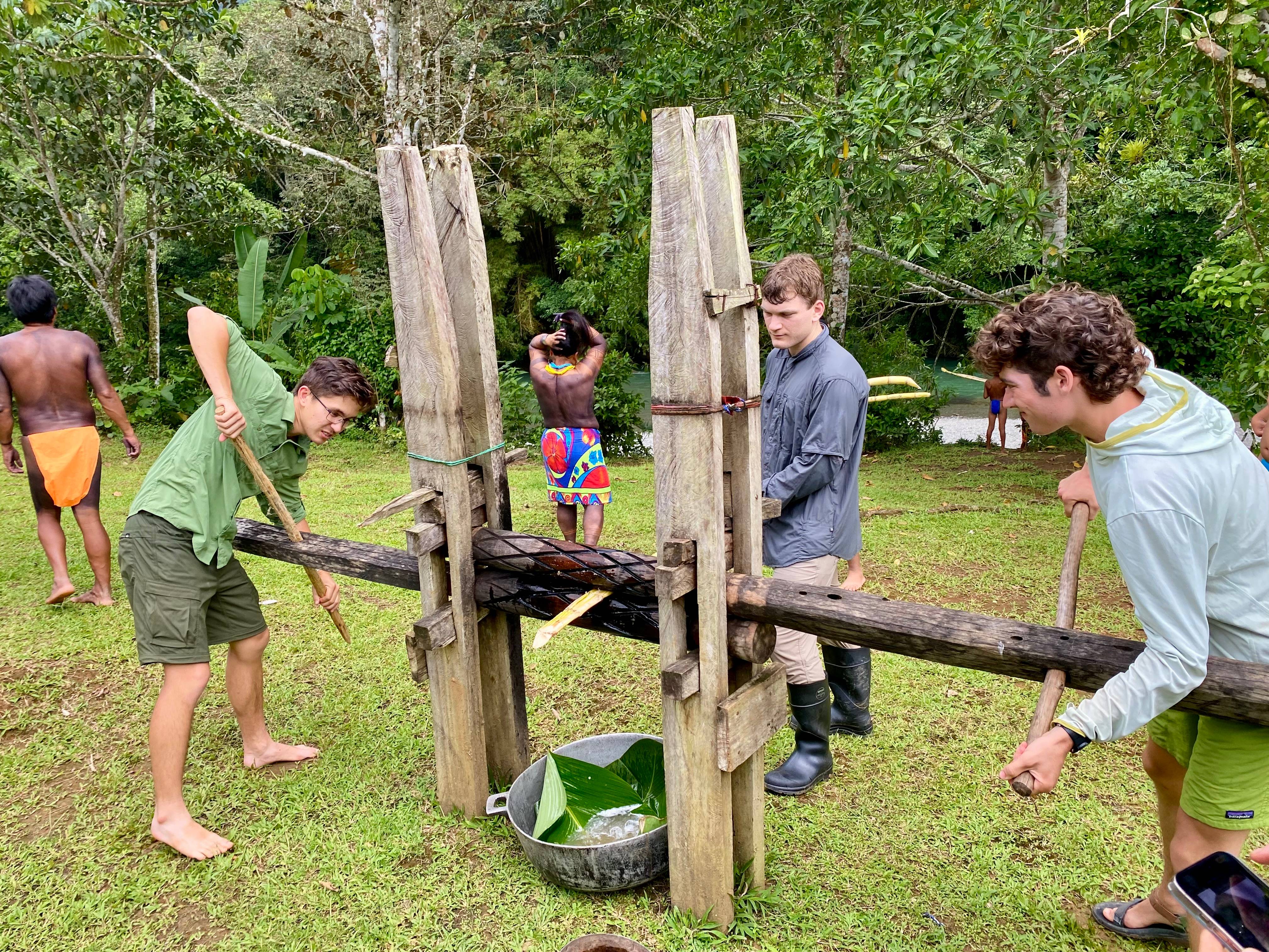 a group of childs working on a wooden structure