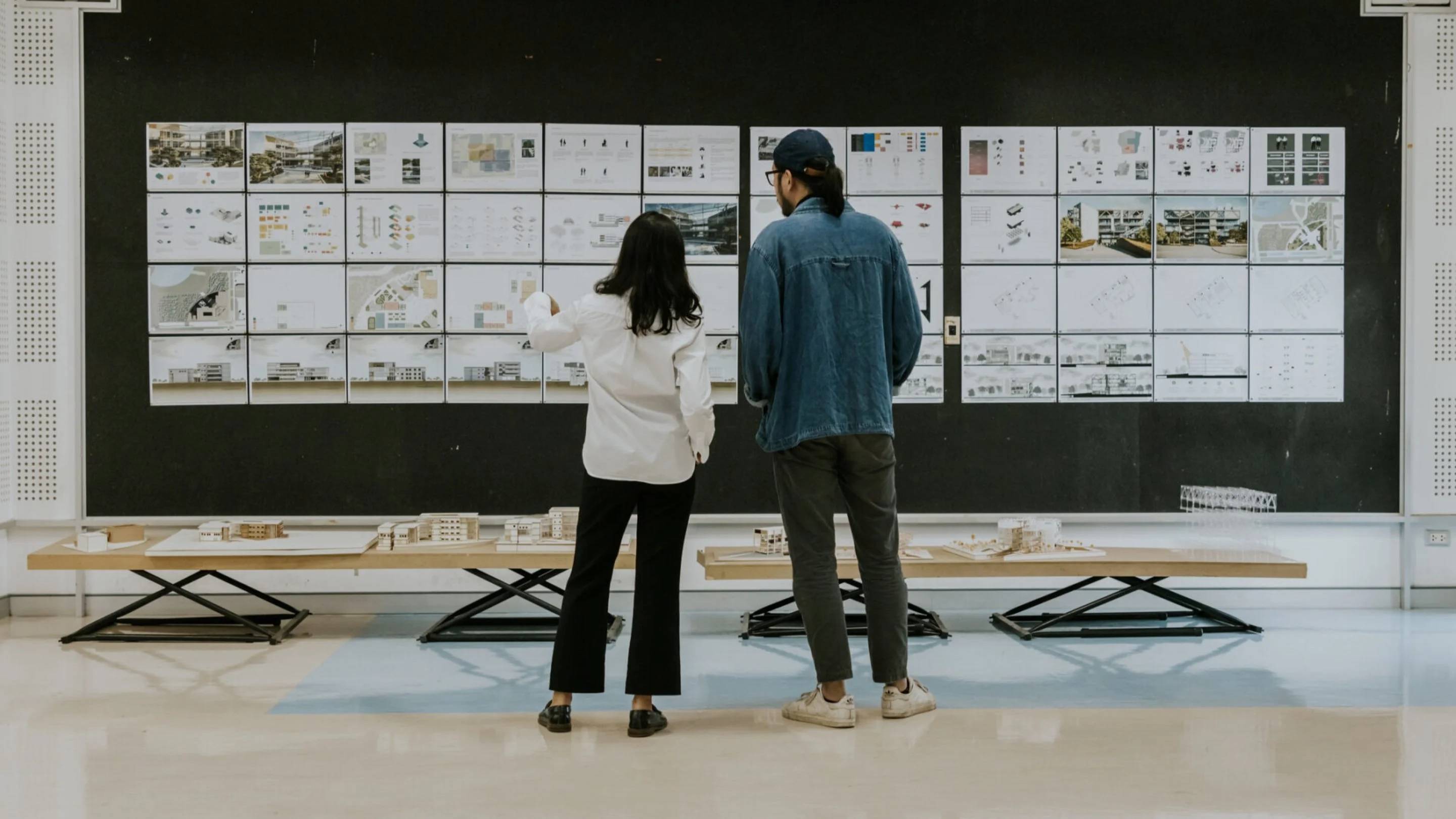 a person and person looking at a board