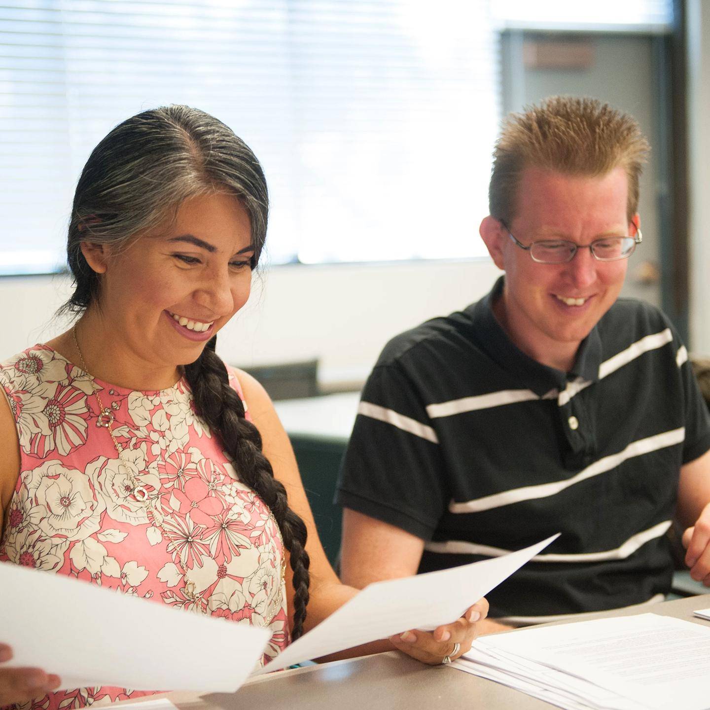 a person and person looking at papers