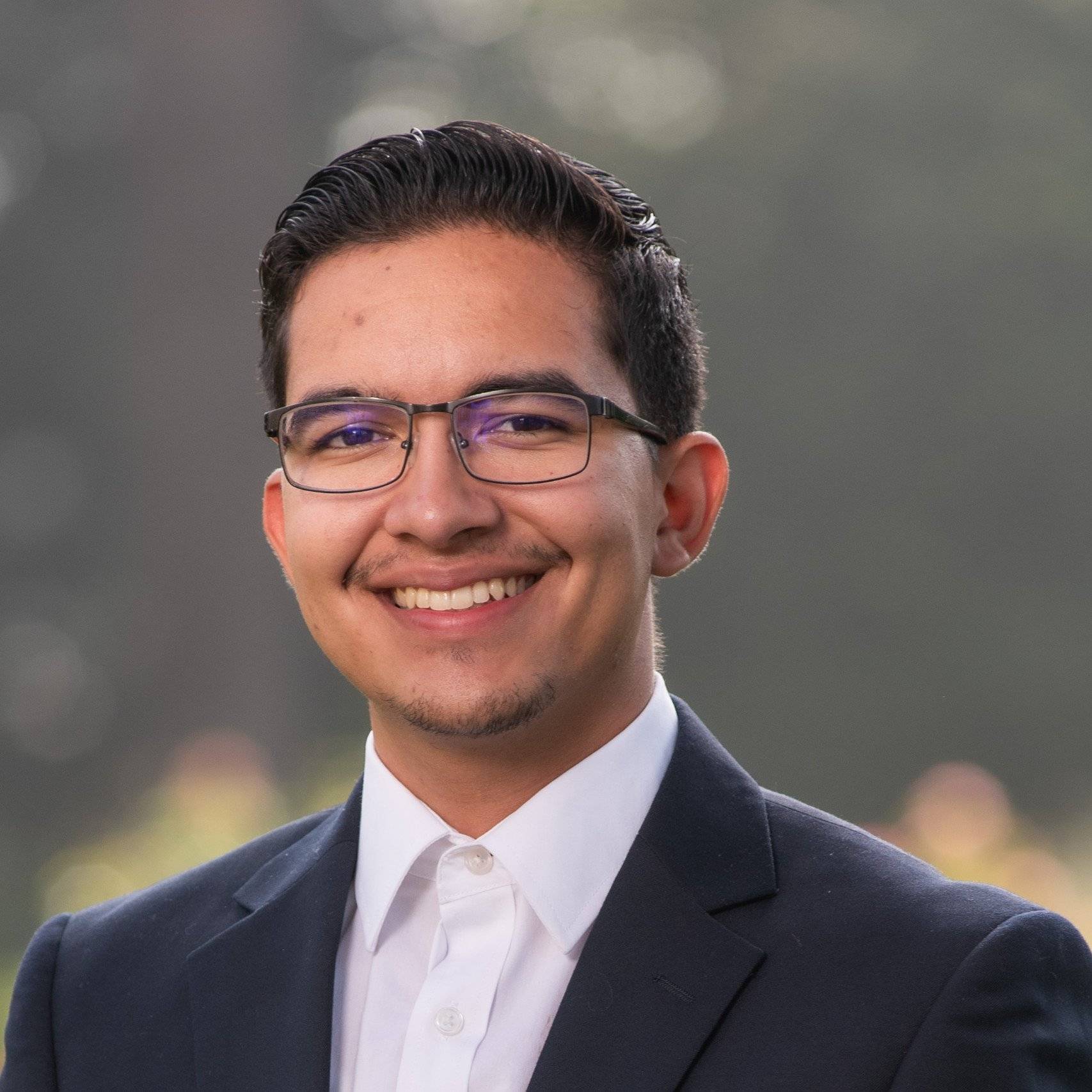 a person in a suit smiling