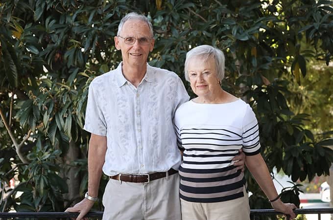 a person and person standing together