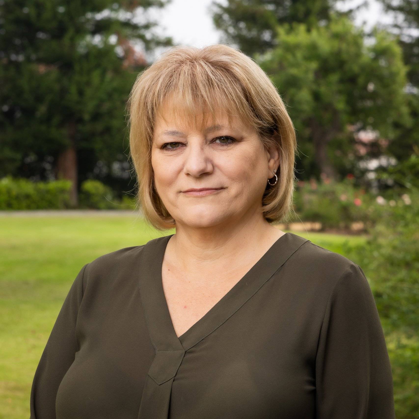 a person standing in a grass field