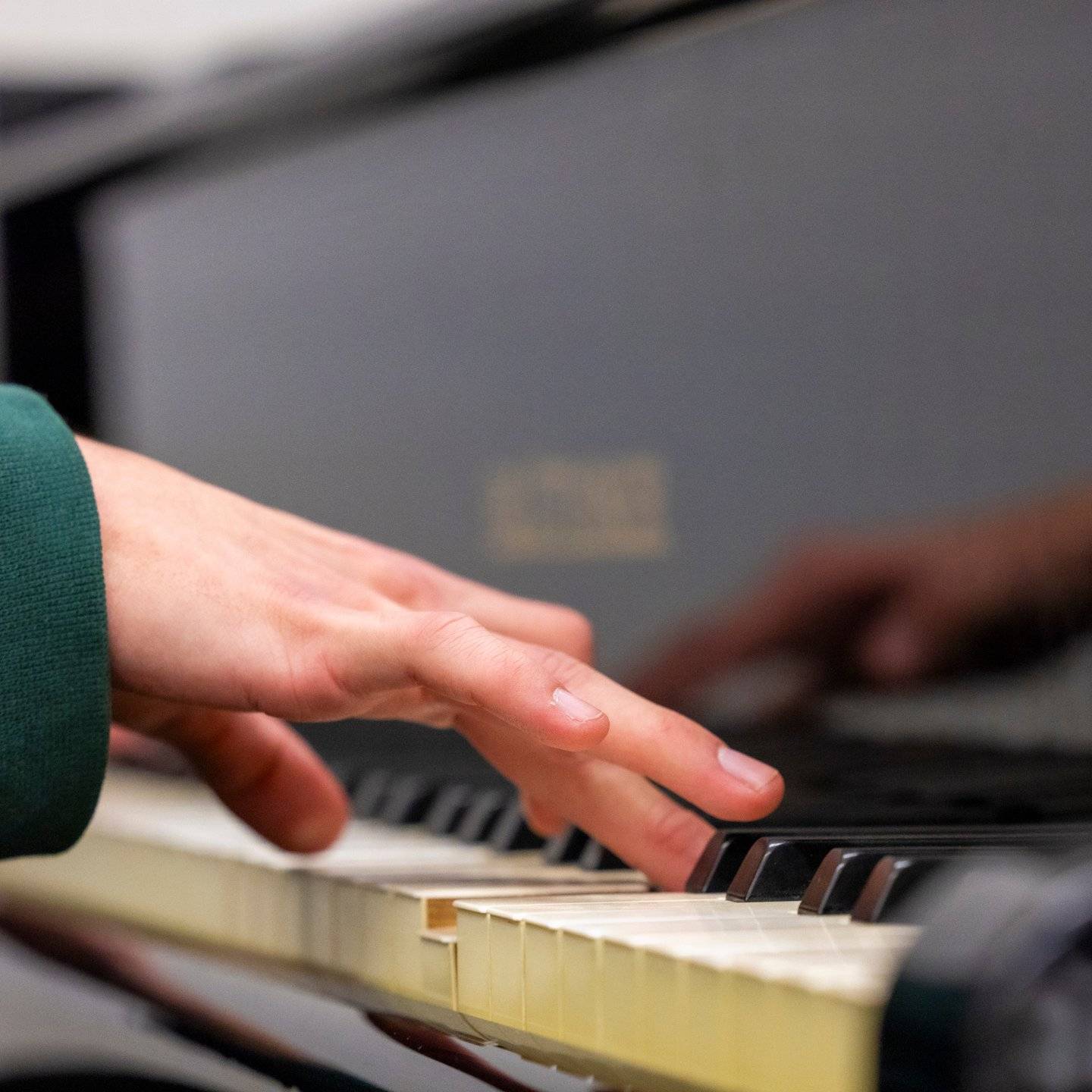 a person playing a piano