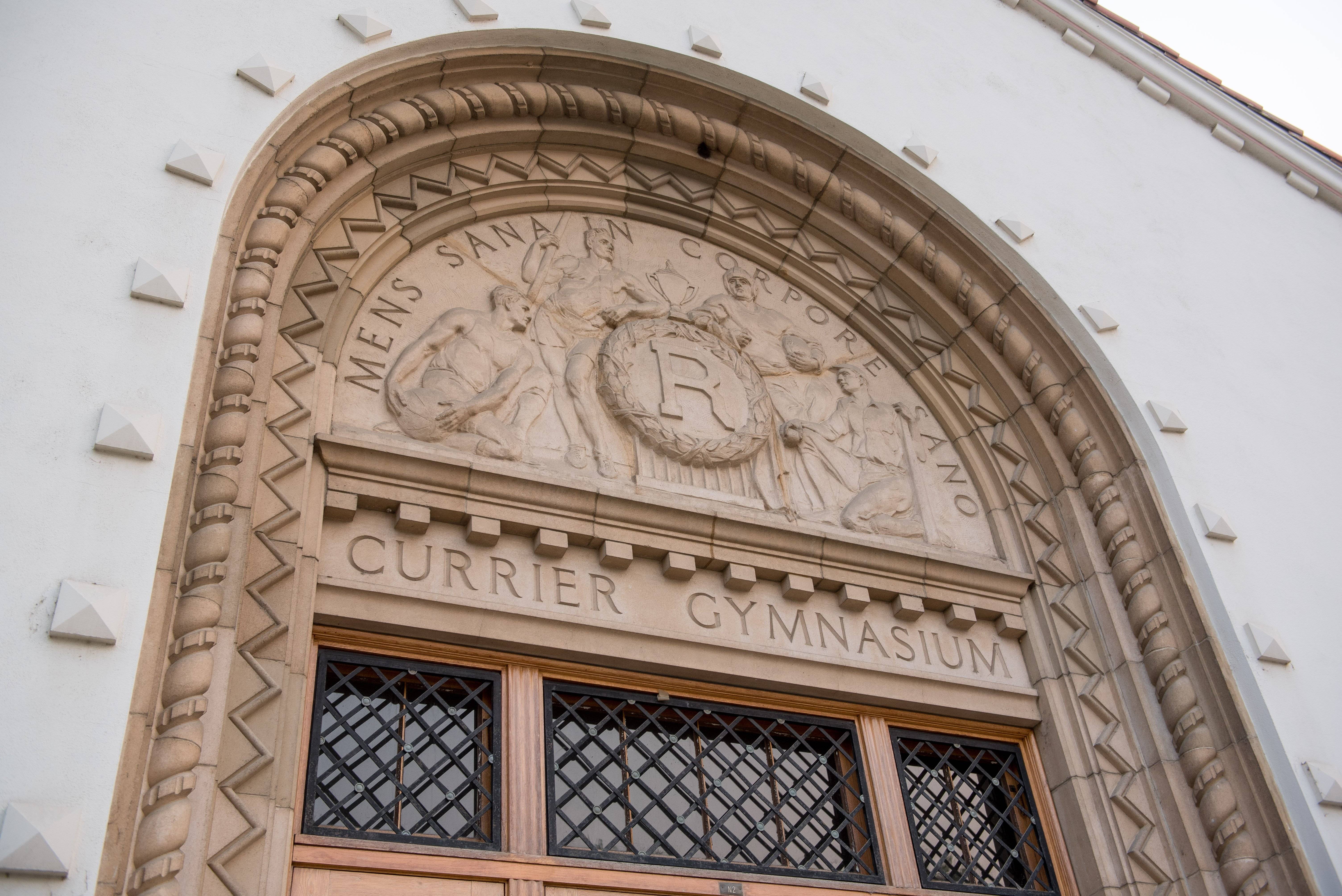 a stone building with a carved sign