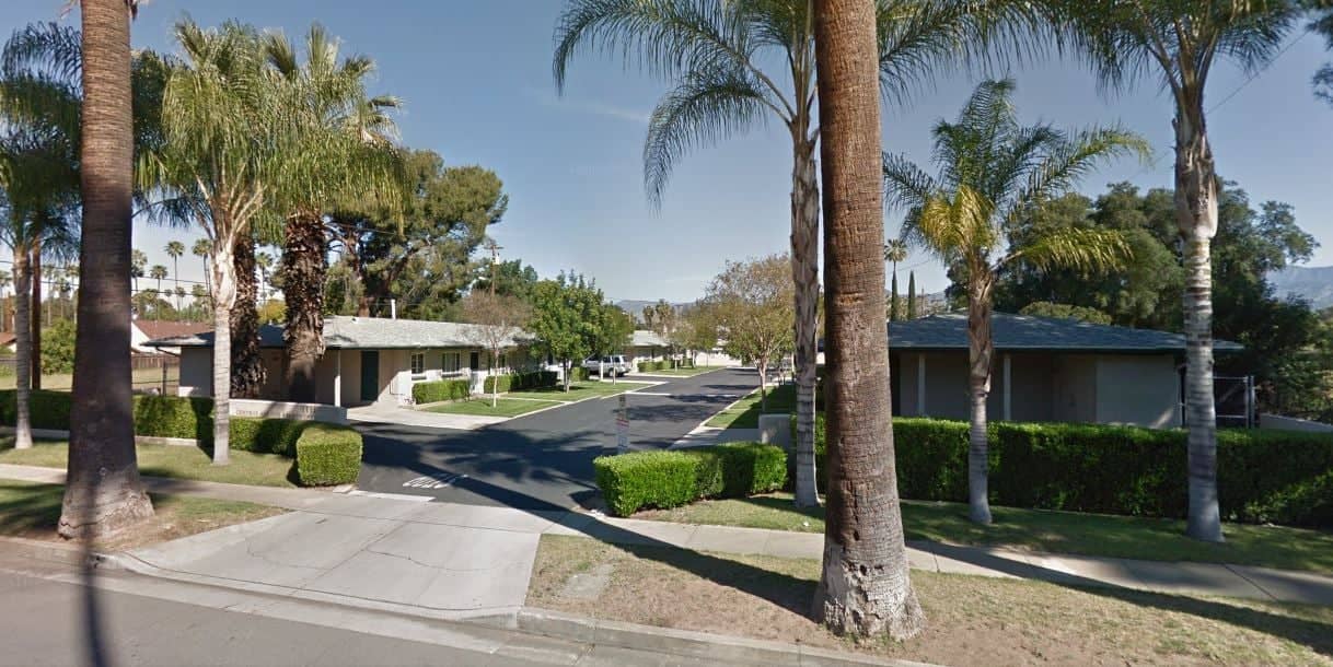 a street with trees and houses