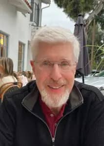 a person with white hair and beard