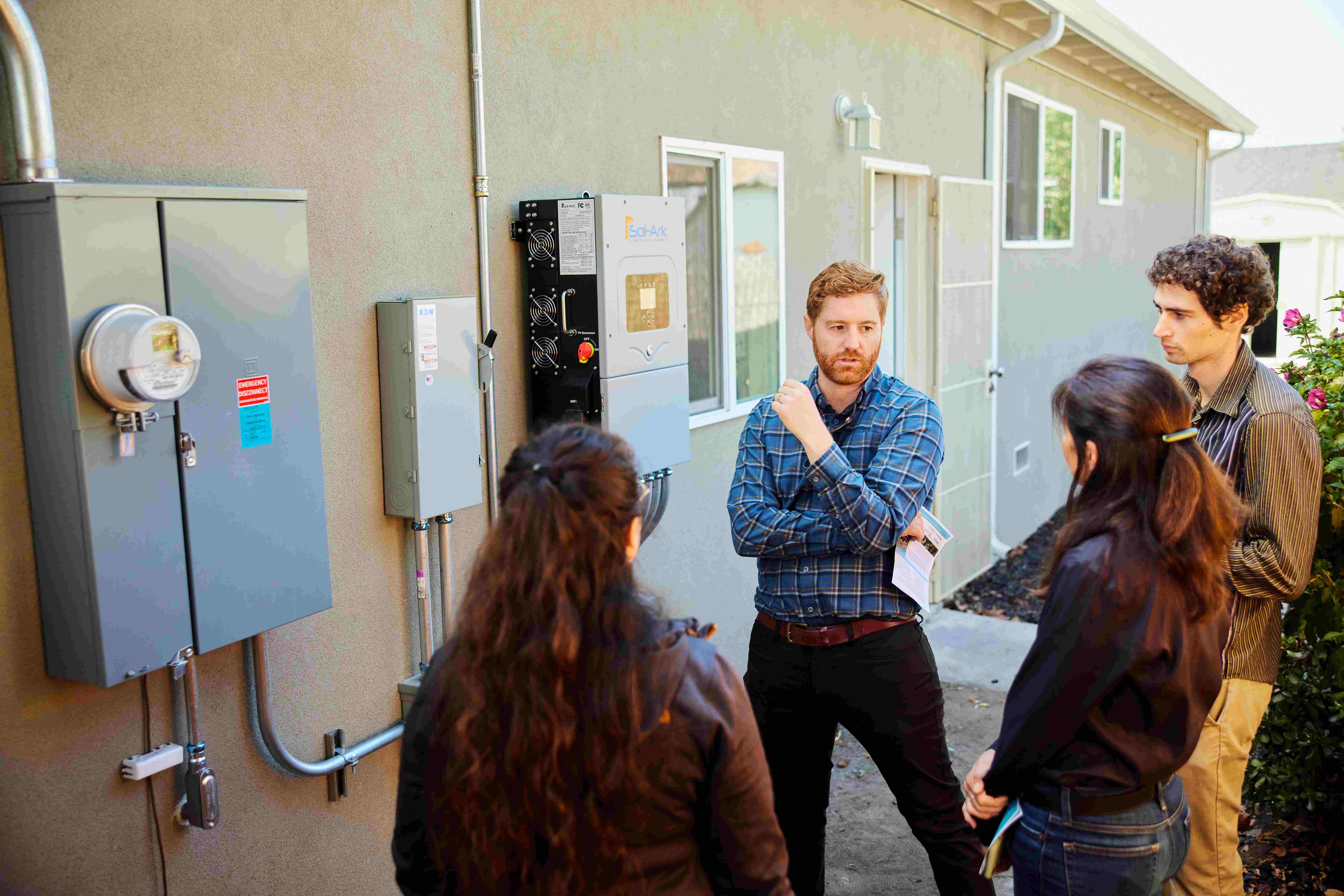 a person standing outside a building with a group of people