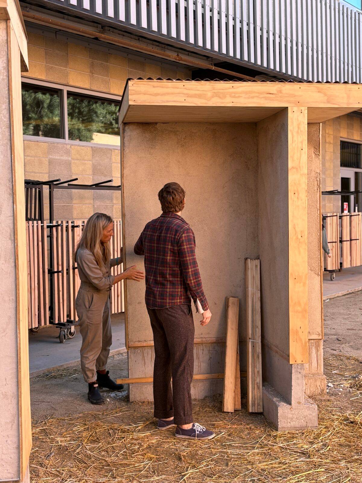 a person and person standing in a building