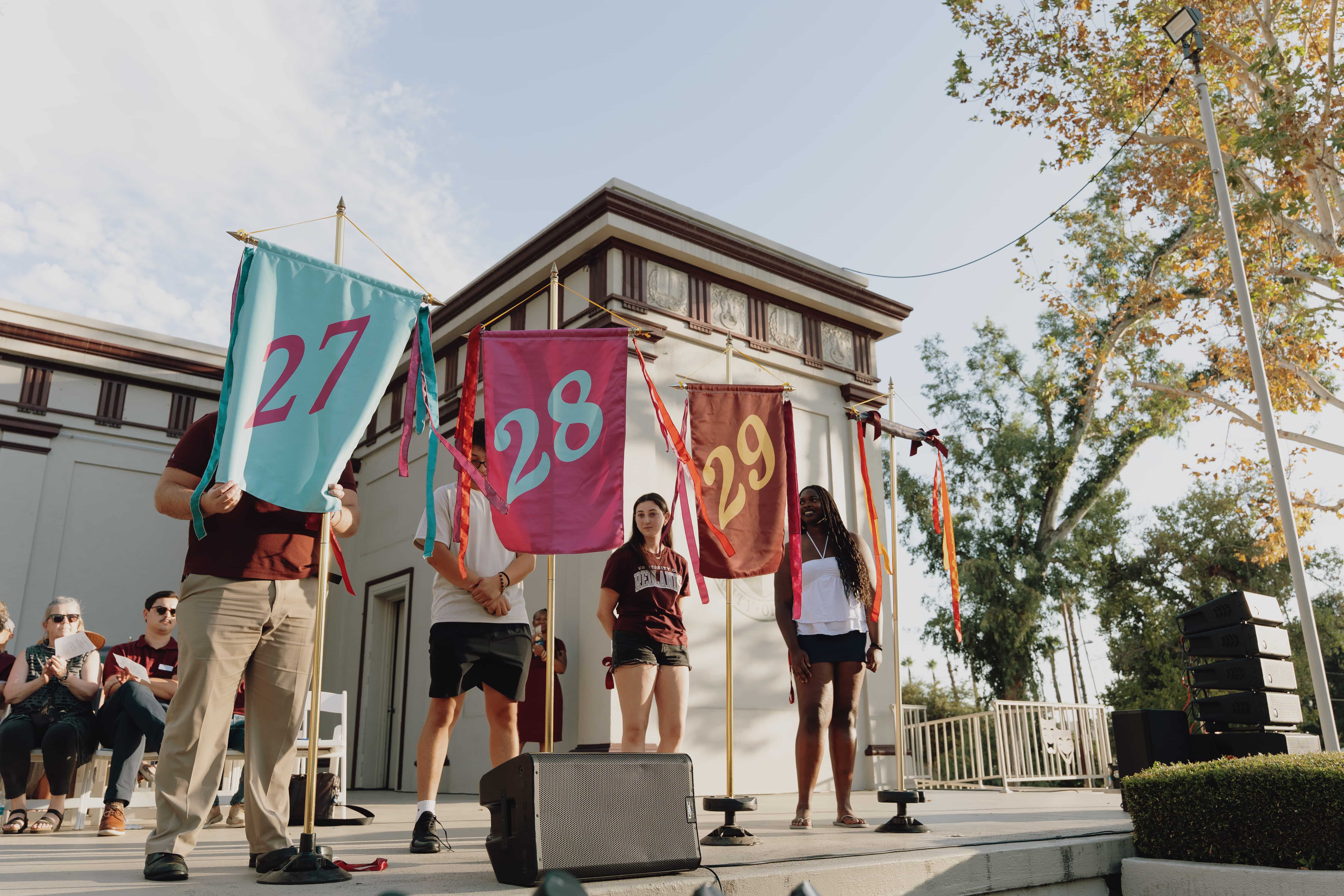 a group of people holding flags