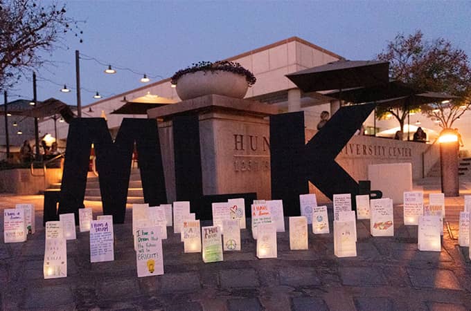 a group of paper lanterns on a stone walkway