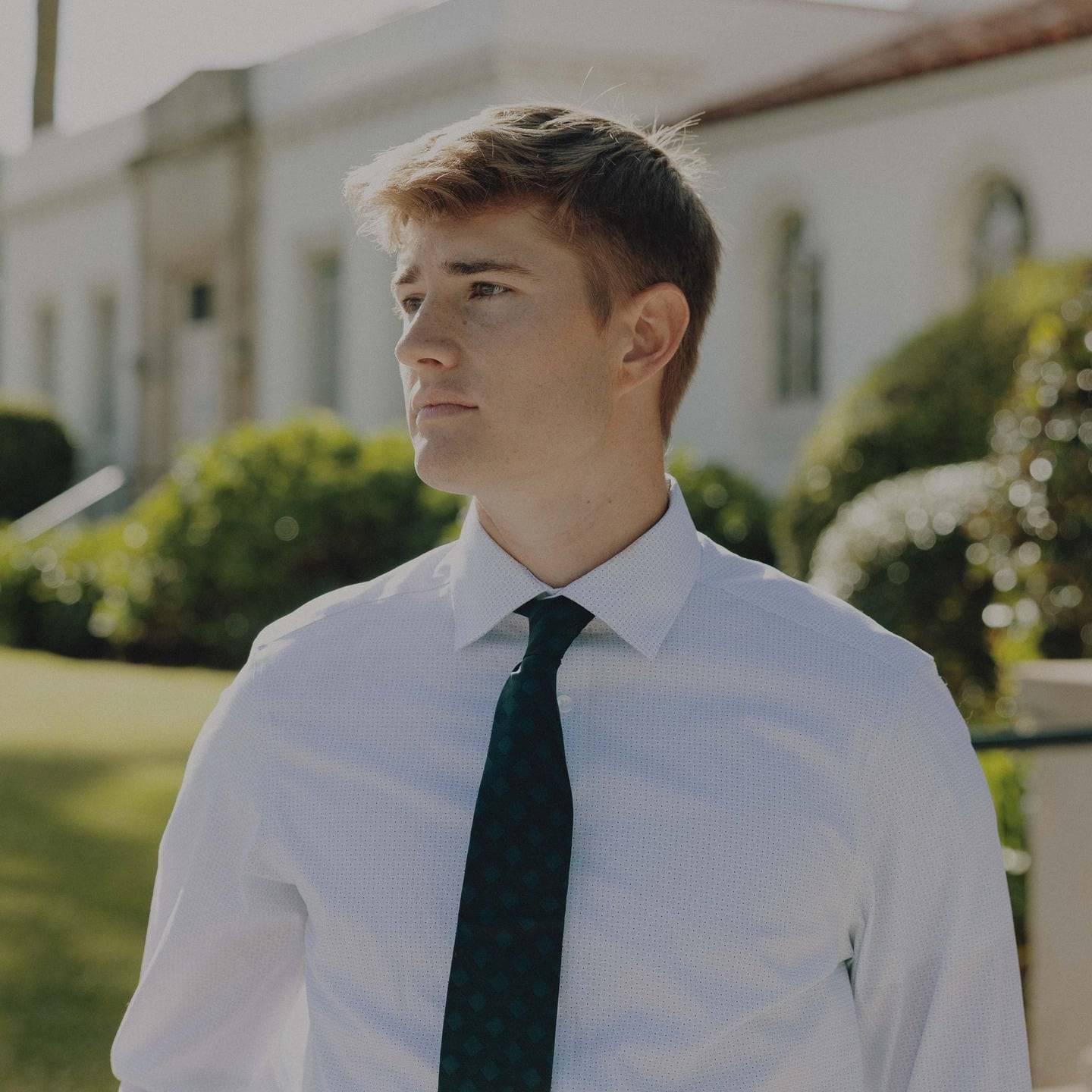 a person in a white shirt and tie